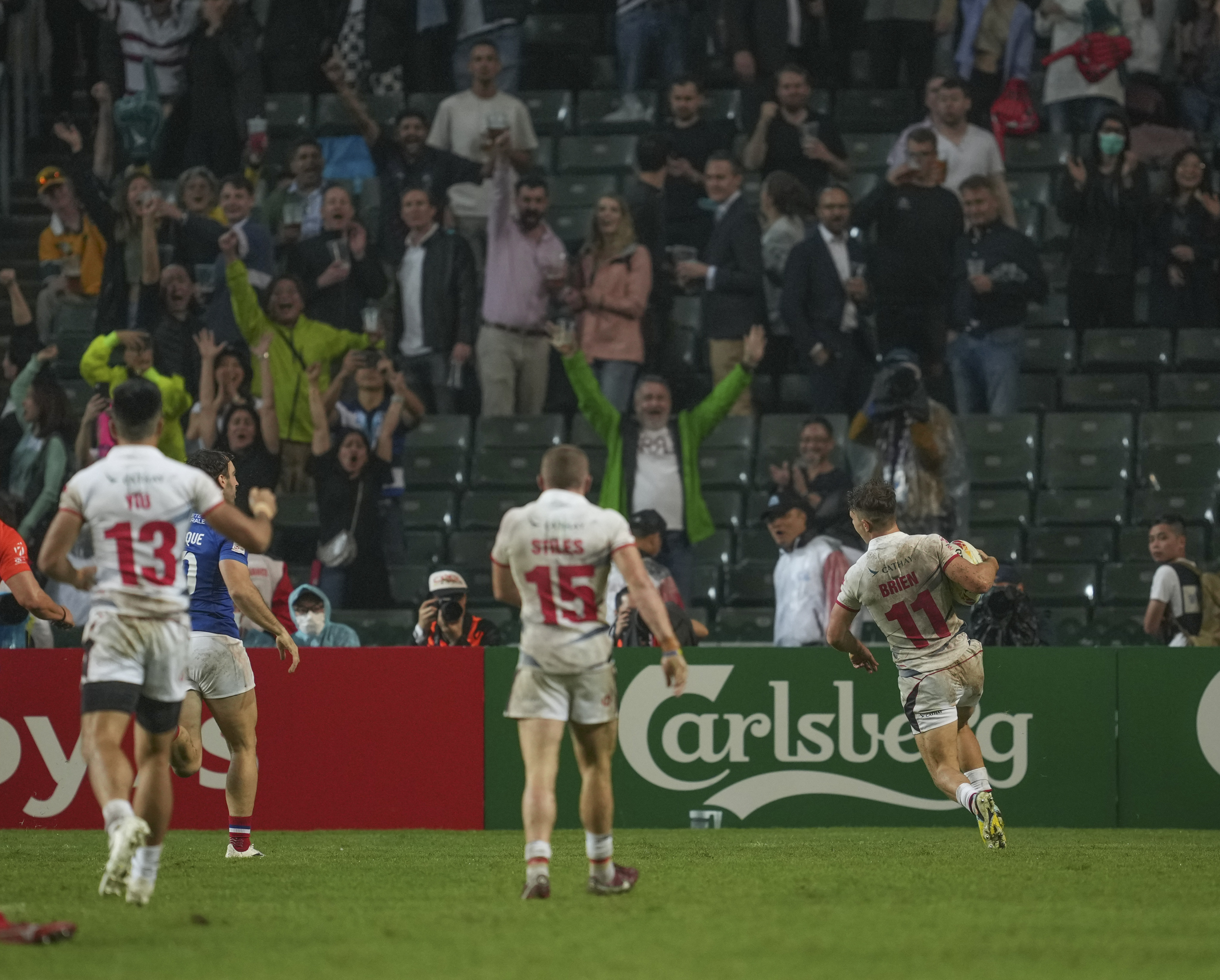Hong Kong’s Seb Brien goes over for a try against France in front of the South Stand. Photo: Sam Tsang