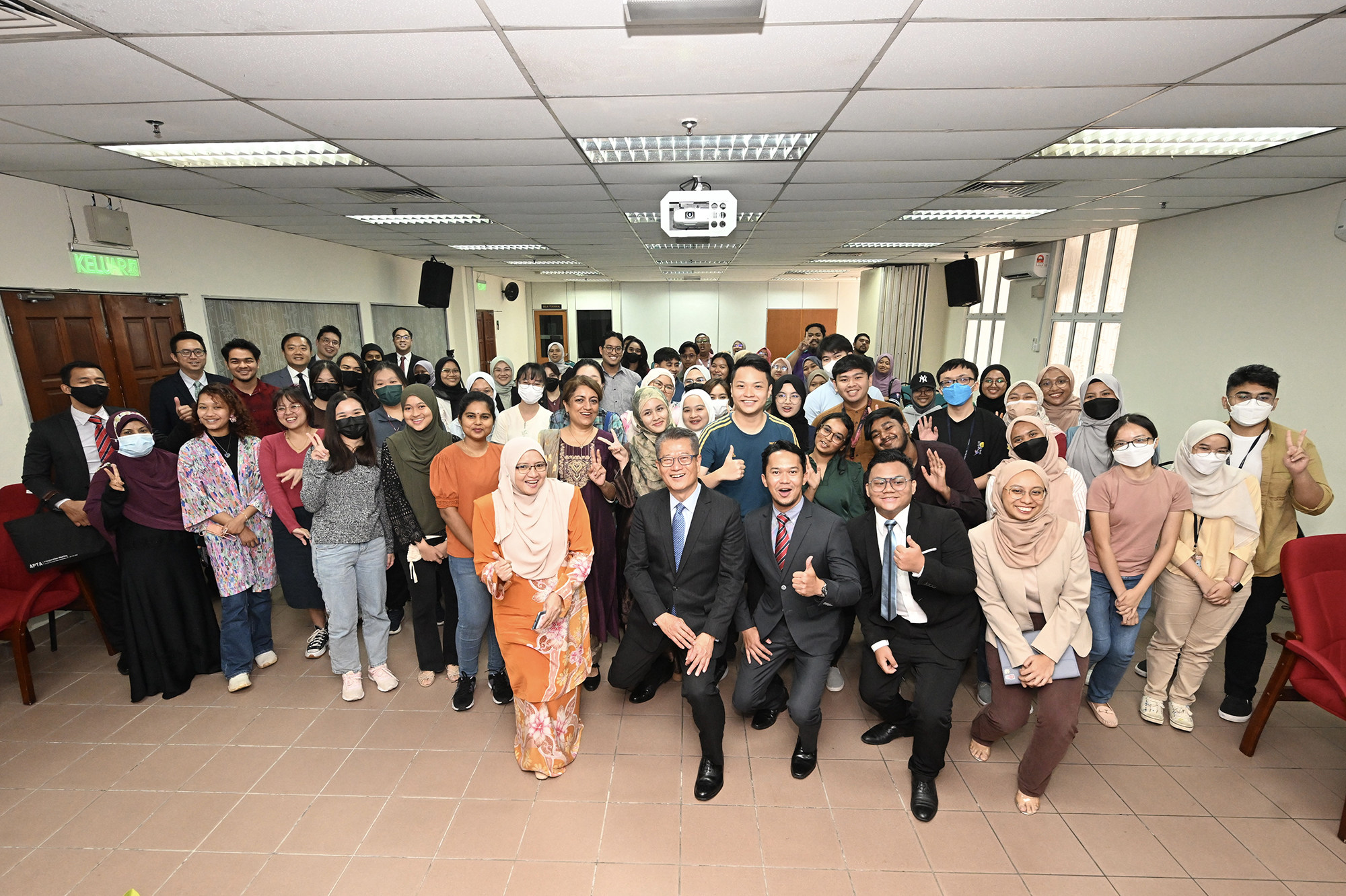Financial Secretary Paul Chan meets university students in Malaysia. Photo: Handout