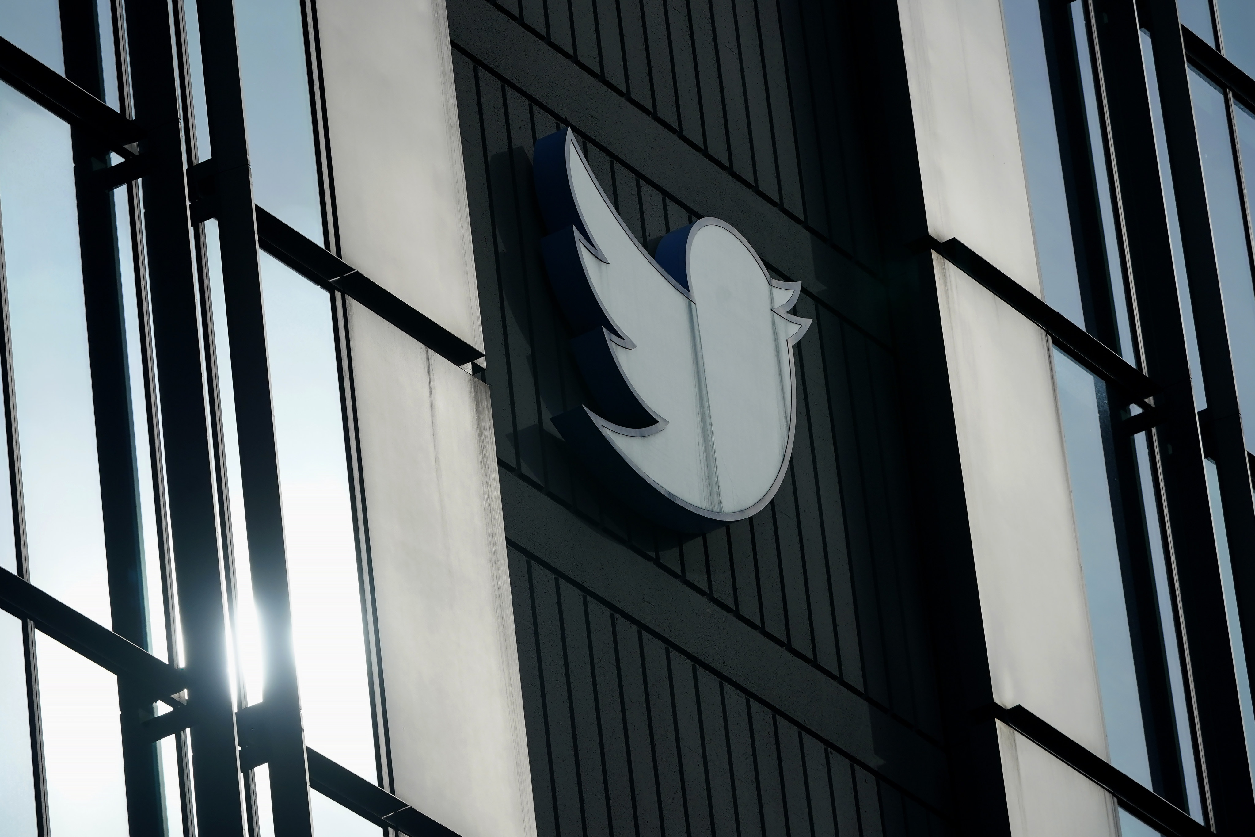 A Twitter logo hangs outside the company’s offices in San Francisco. Photo: AP/File