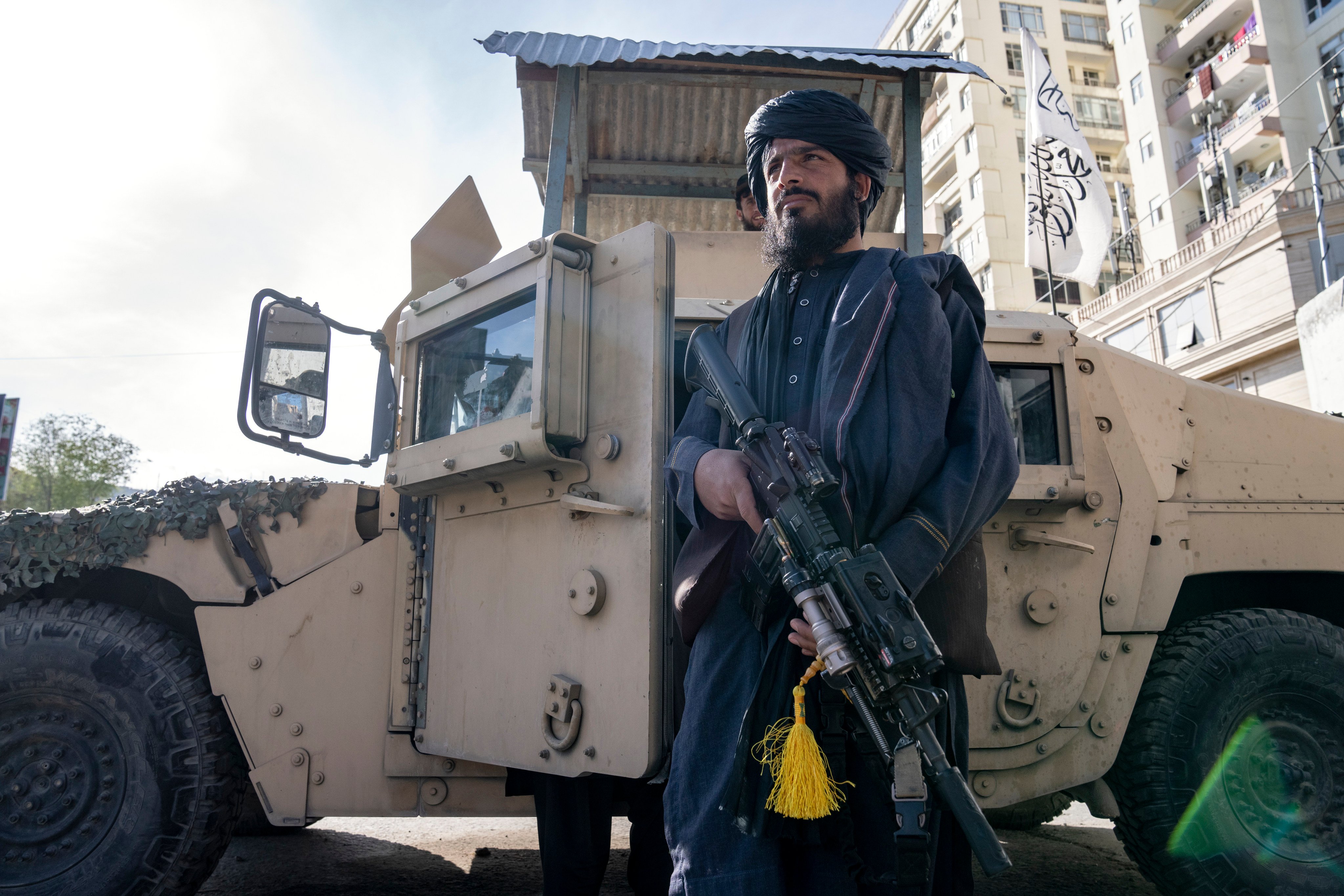 A Taliban fighter stands guard near the Foreign Ministry in Kabul, Afghanistan on Monday. Three British men have been detained by the Taliban in Afghanistan, it was reported on Saturday. Photo: AP 