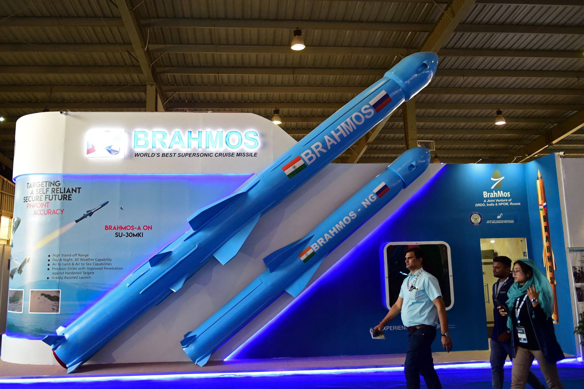 Visitors walk past a model of India’s Brahmos supersonic cruise missile displayed at a defence exposition last year. Photo: AFP