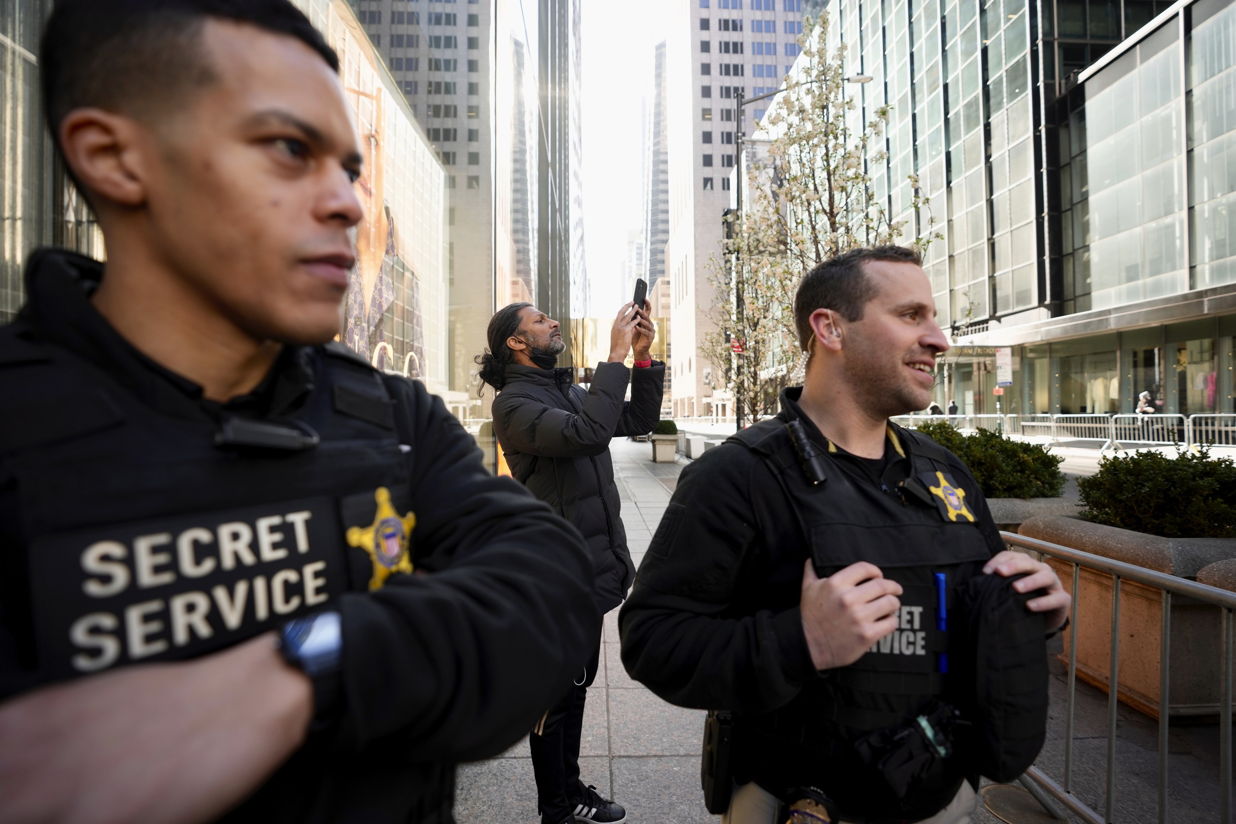 Members of the United States Secret Service stand outside Trump Tower on Monday. Photo: AP