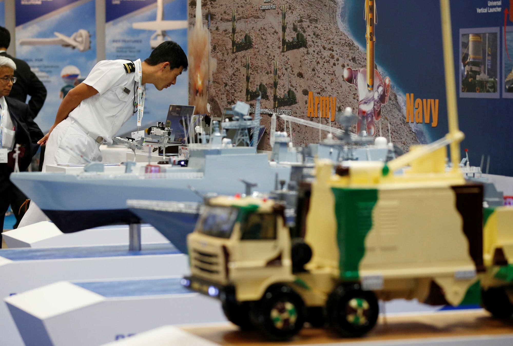A visitor looks at a booth advertising India’s Brahmos system at a defence expo in Japan in 2017. Photo: Reuters