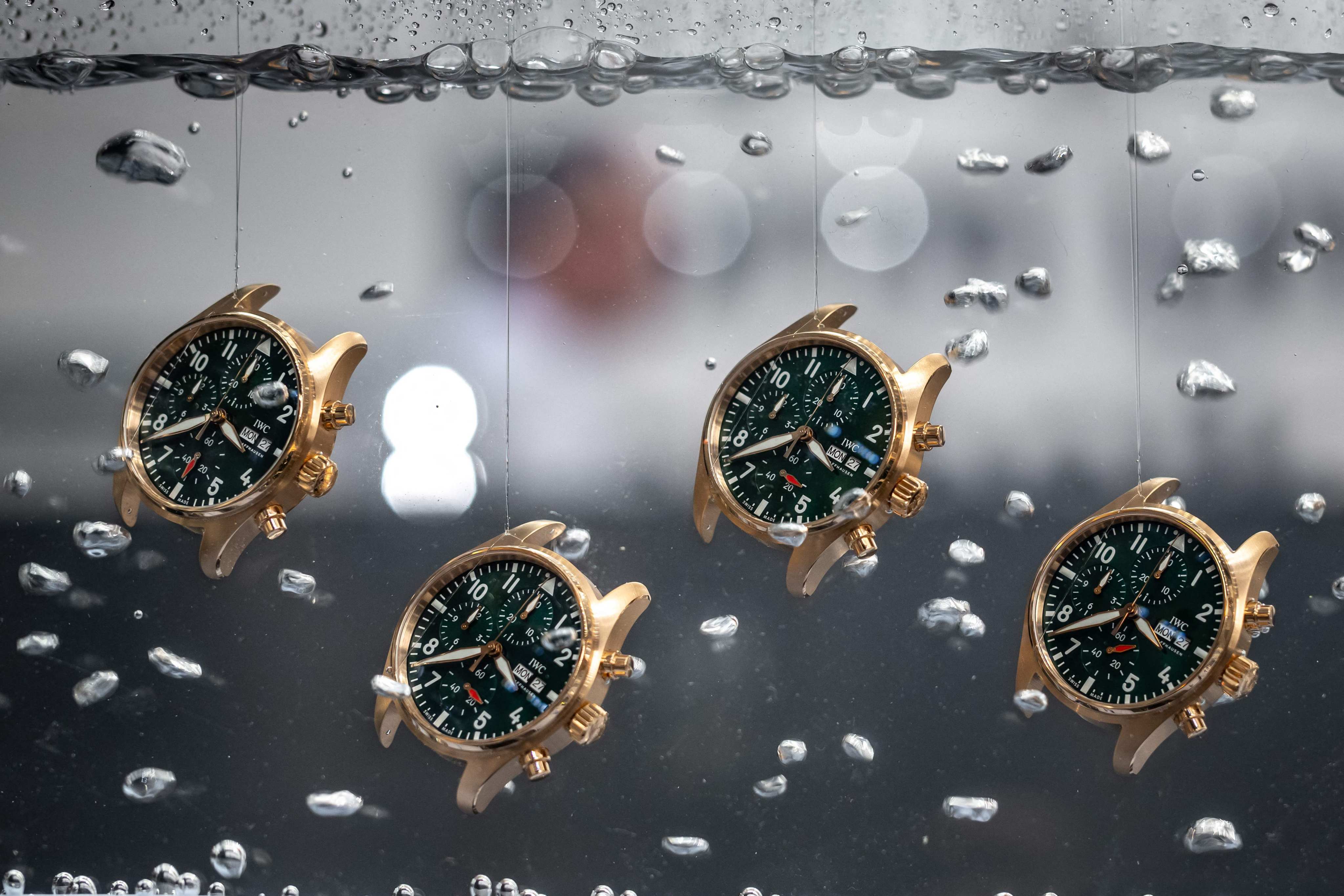 Watches are seen in water at the booth of Swiss watch manufacturer IWC on the opening day of the luxury watch fair Watches and Wonders, on March 27, in Geneva. Photo: AFP