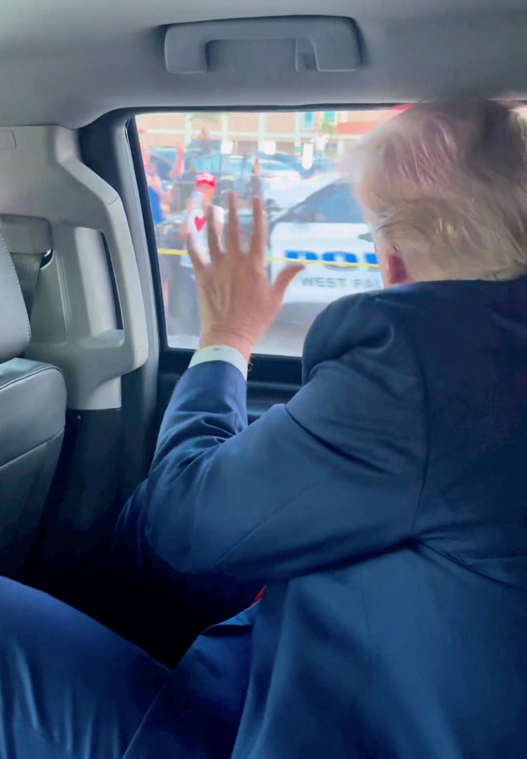 Trump waves to a crowd en route to Mar-a-Lago in Palm Beach, Florida, on Tuesday. Photo: Instagram/Eric Trump via Reuters