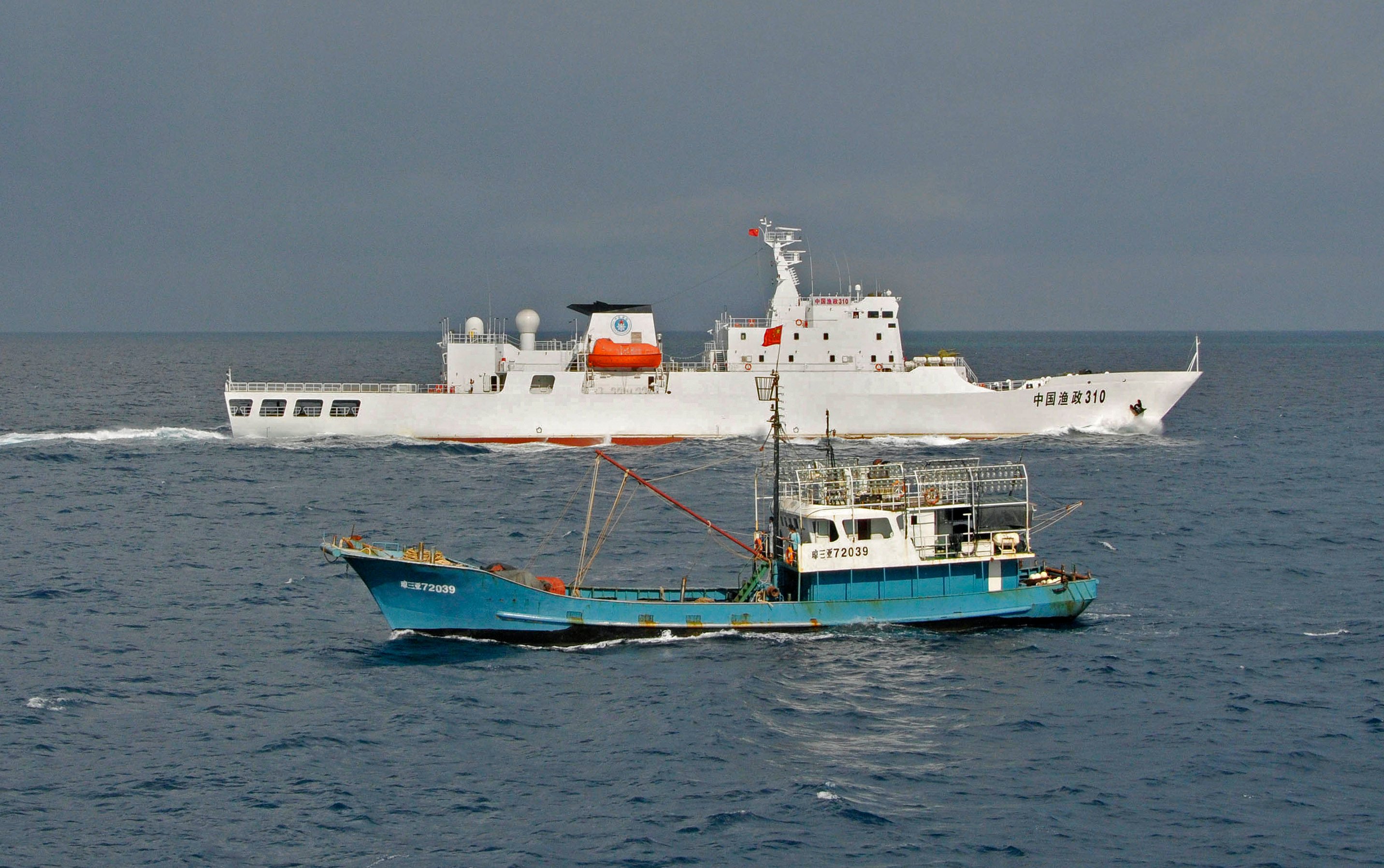 Chinese fishing vessels near Yongshu reef of the Spratly islands in the South China Sea. Photo: AP