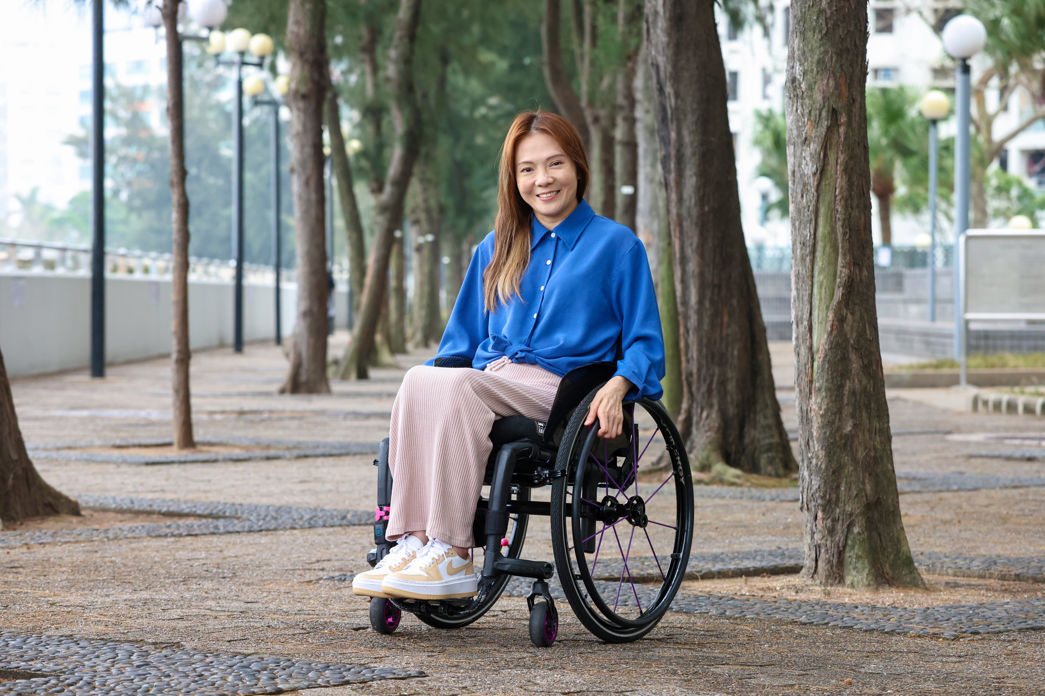 Rabi Yim Chor-pik at her home. She was badly injured in a car accident in 1998 which left her in a wheelchair. Photo: K.Y. Cheng