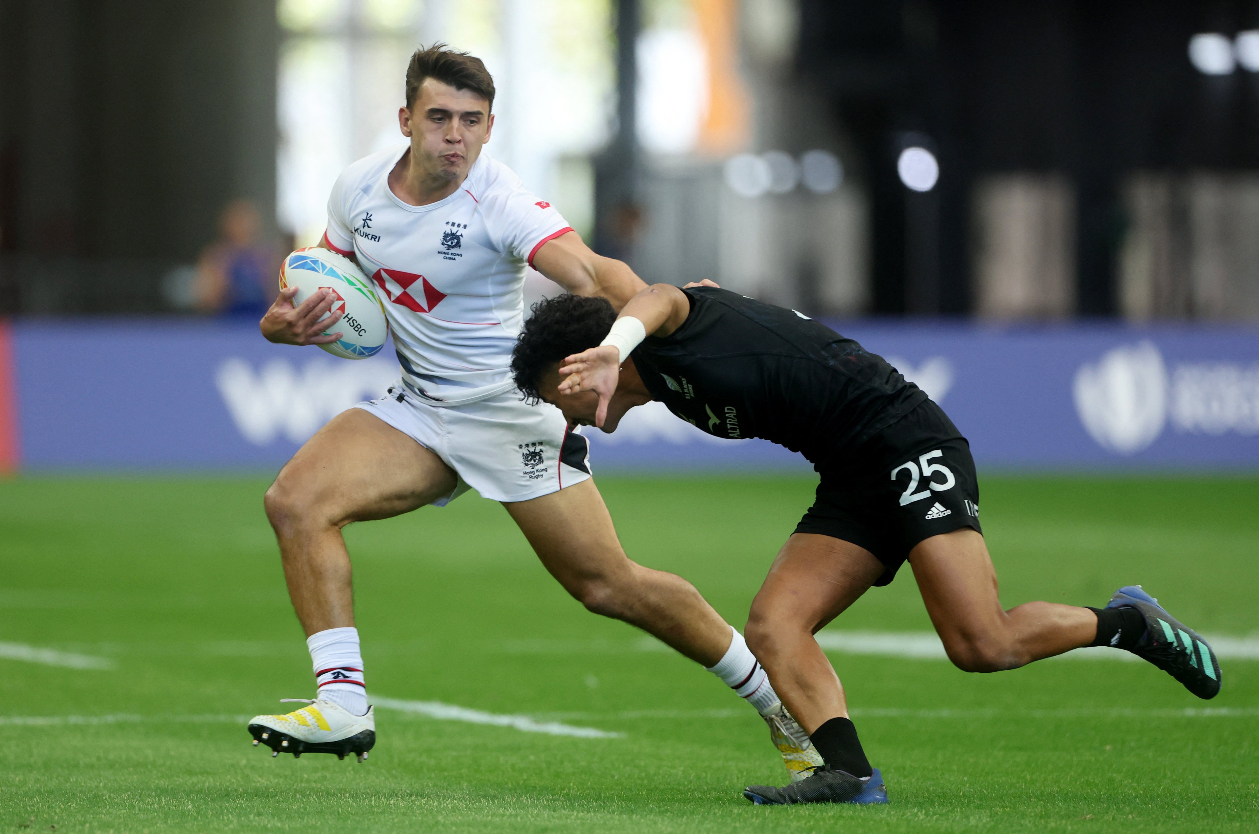 James Sawyer of Hong Kong is tackled by New Zealand’s Cody Vai at the Singapore Sevens. Photo: Reuters