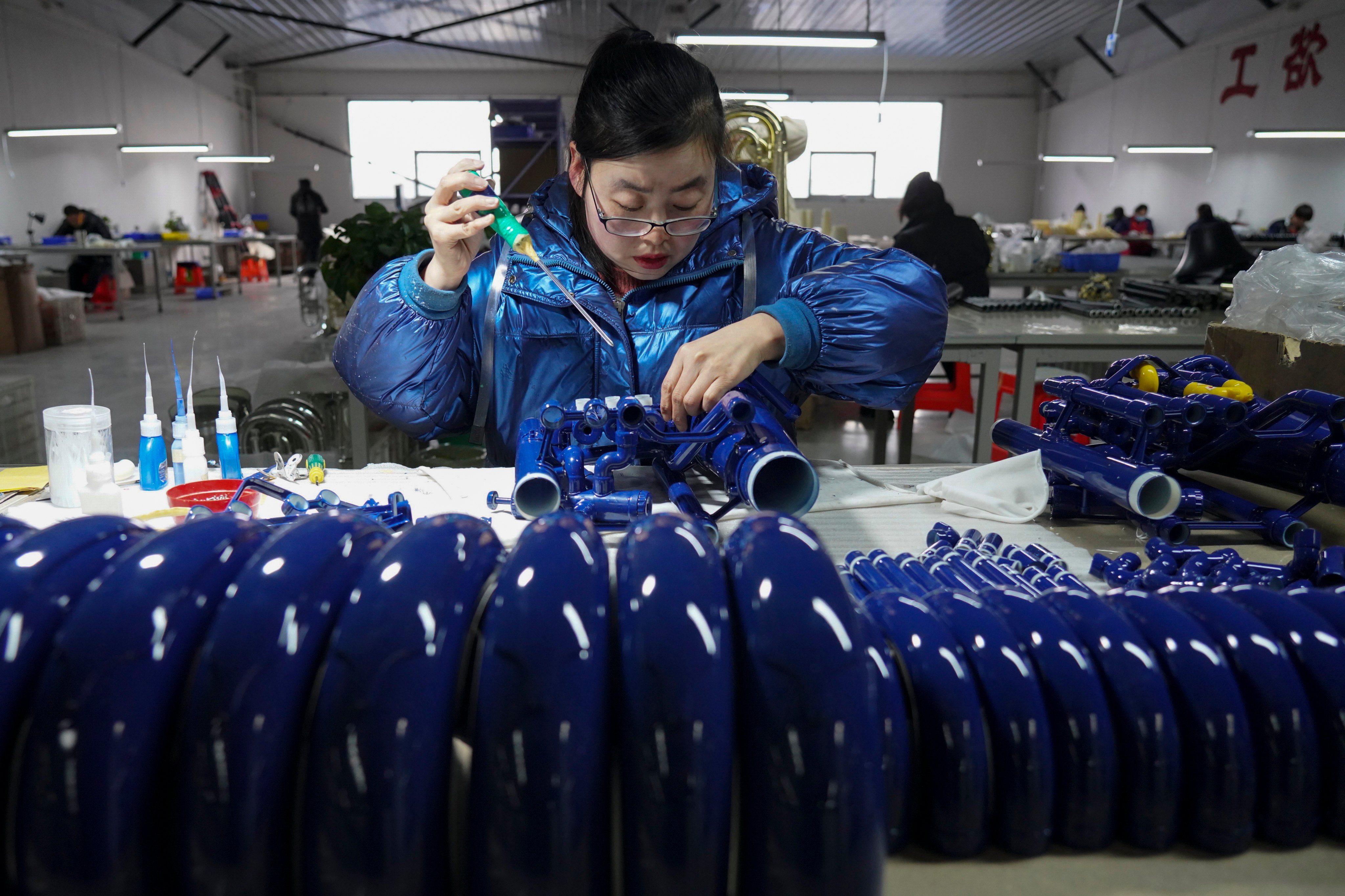 A worker assembles Western musical instruments at a factory in Wuqiang, Hebei province, China, on February 23. The export-oriented industrialisation model has run out of steam for reasons that have little to do with the Global North’s protectionist policies. Photo: Xinhua