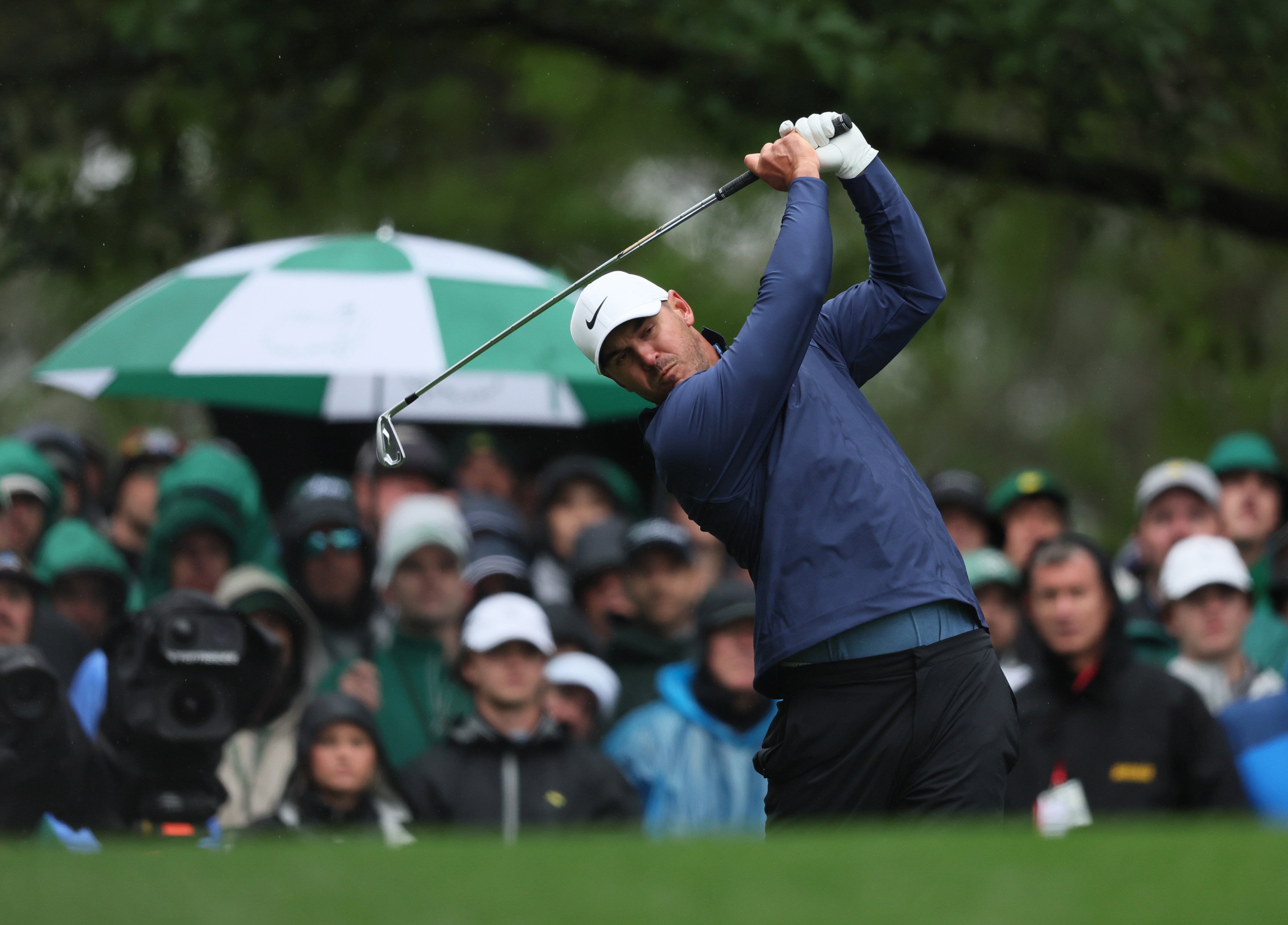 Brooks Koepka tees off on the fourth hole during a rain-disrupted third round of the Masters. Photo: TNS