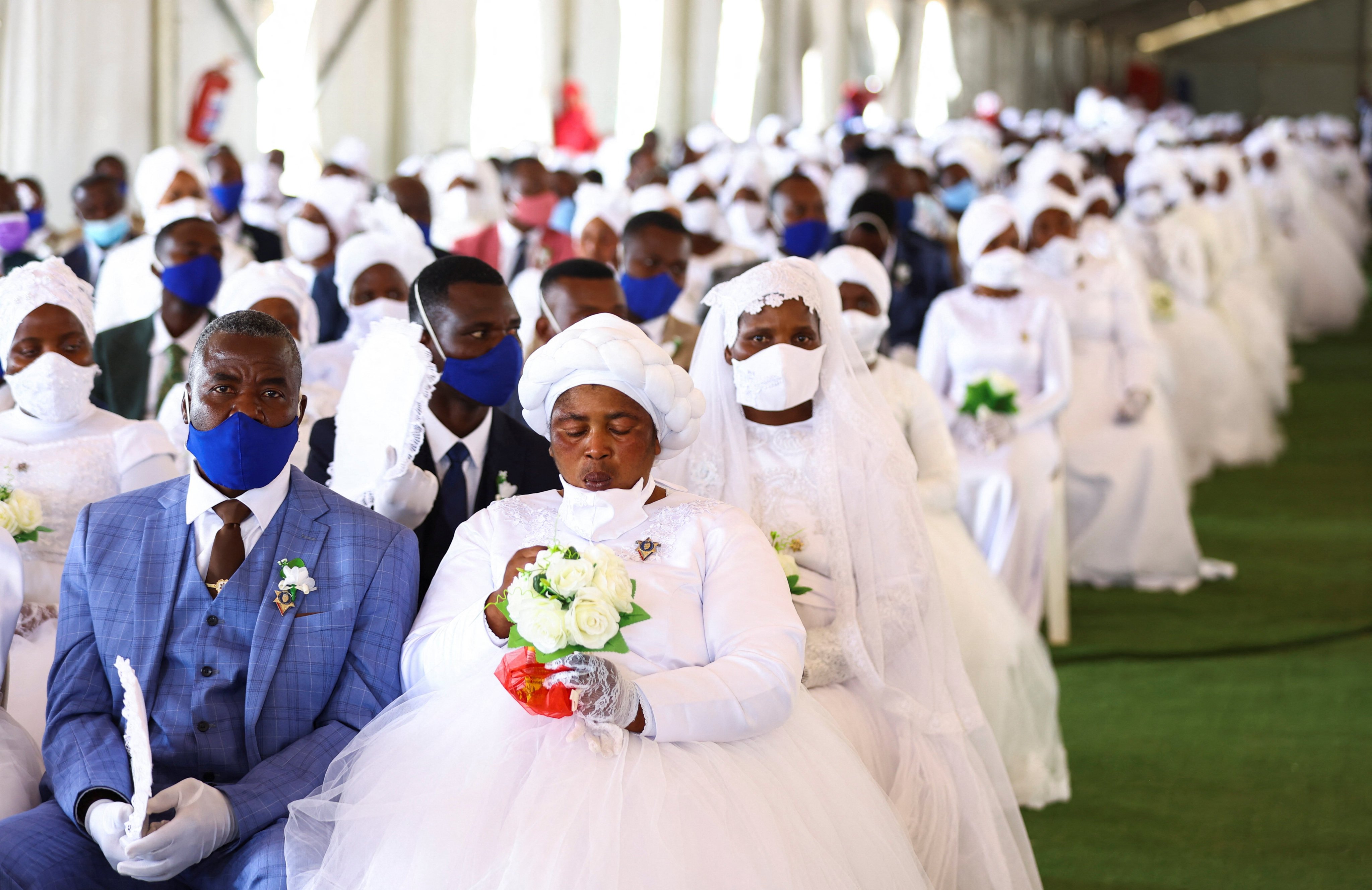 Brides and grooms during a mass wedding ceremony in Kgabalatsane, South Africa on Sunday. Photo: Reuters 
