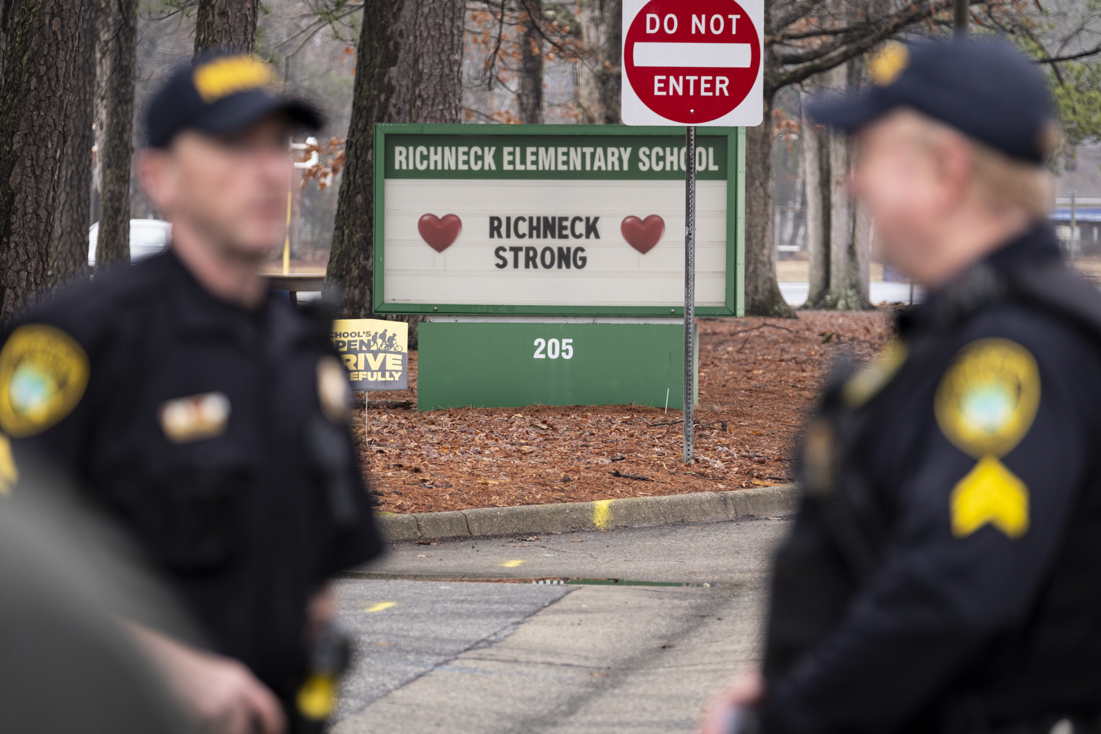 Police look on as students return to Richneck Elementary in Newport News, Virginia, in January. Photo: The Virginian-Pilot via AP