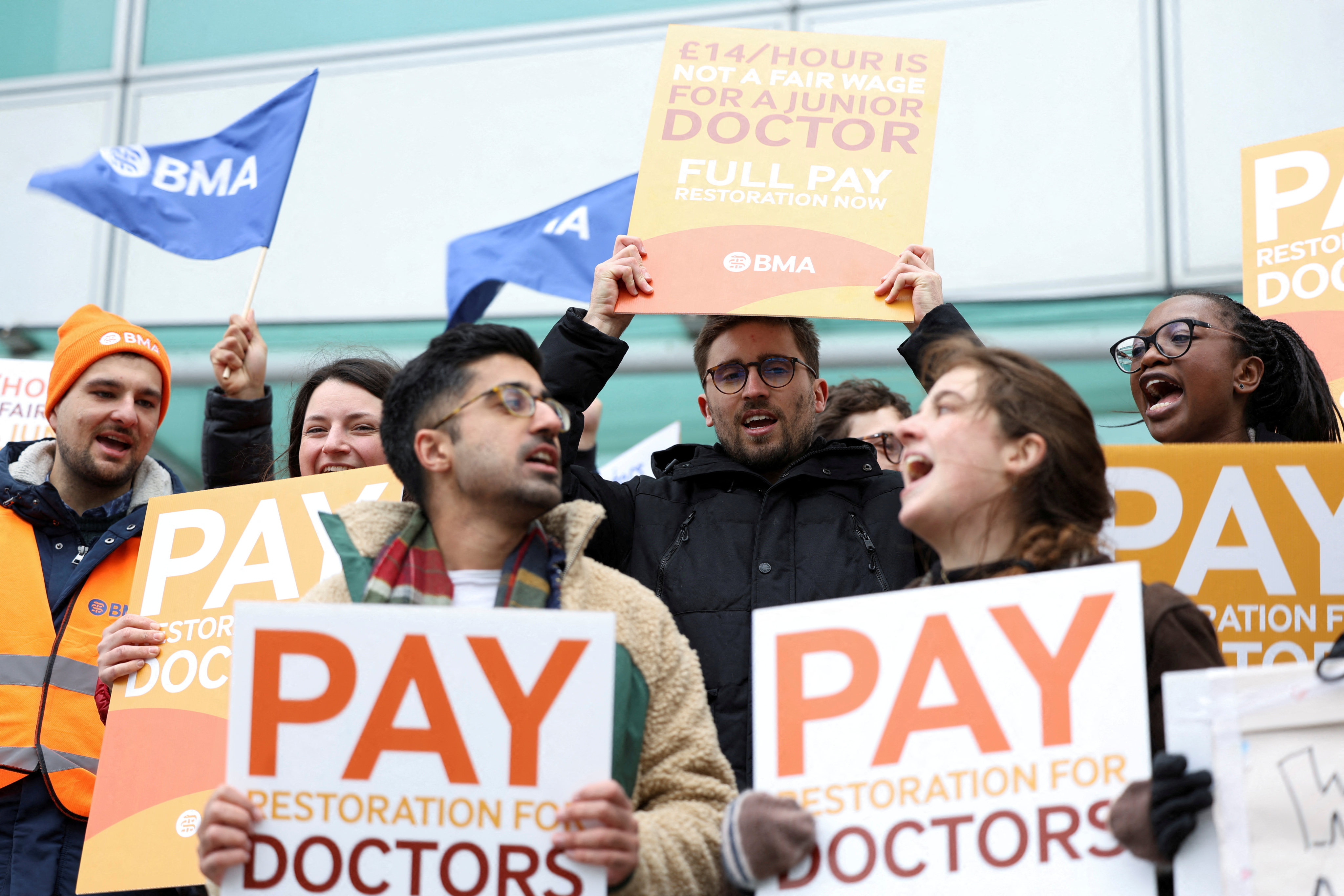 People attend a protest by junior doctors, amid a dispute with the government over pay, in London on March 13. Photo: Reuters