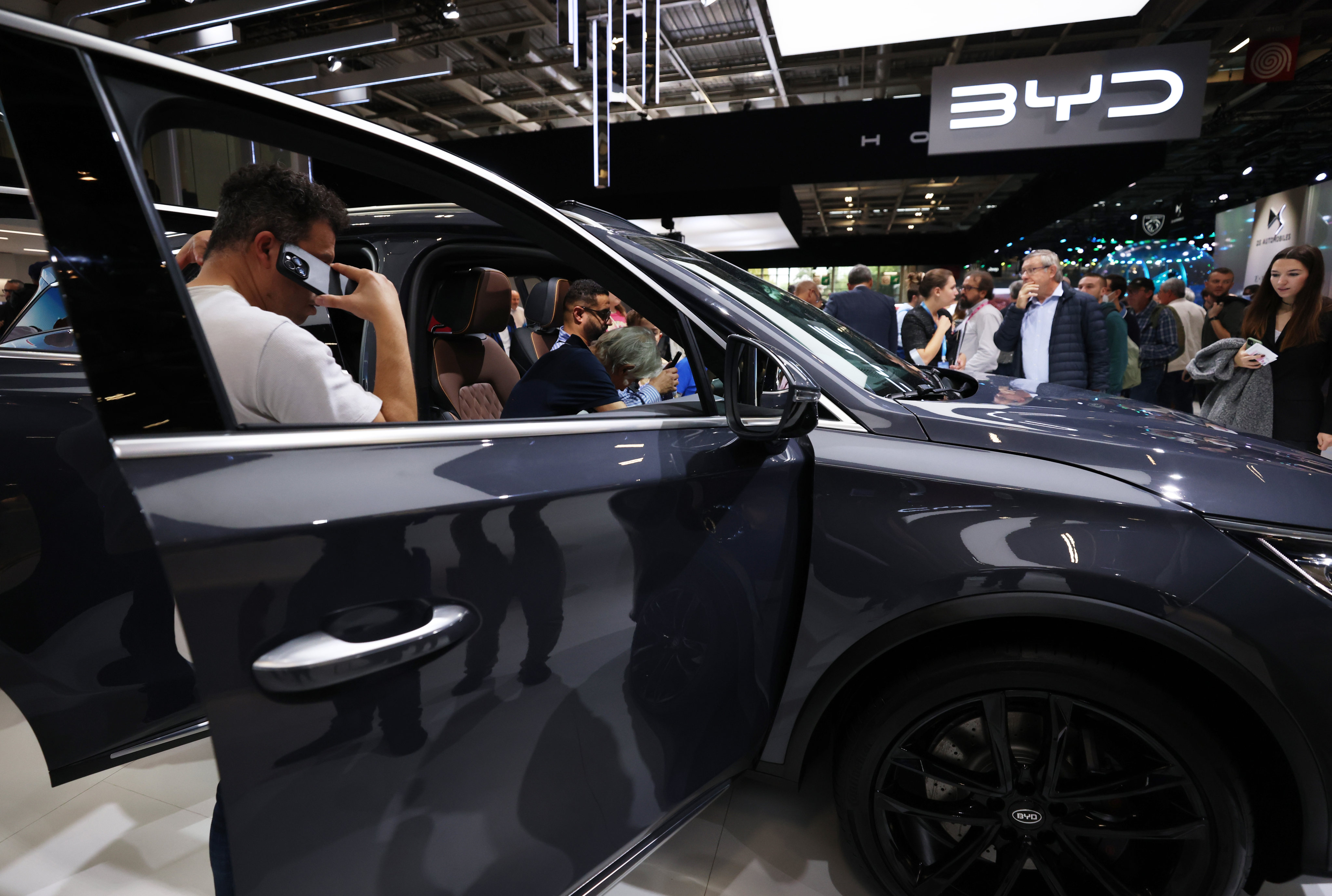People visit the BYD stand during the Paris Motor Show in October last year. Photo: Xinhua