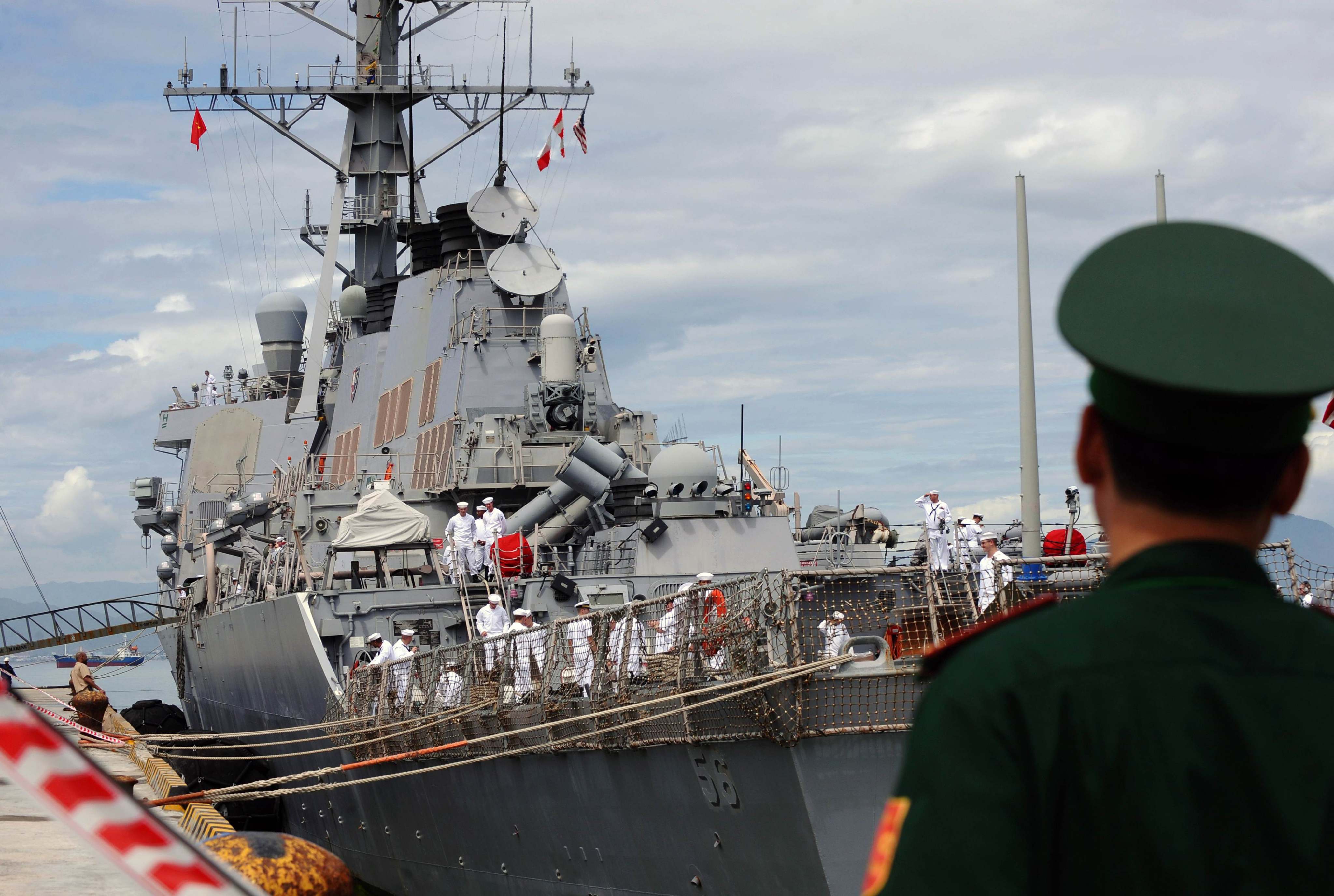 A Vietnamese soldier keeps watch as a US destroyer comes into port in Da Nang in 2010. Photo: AFP