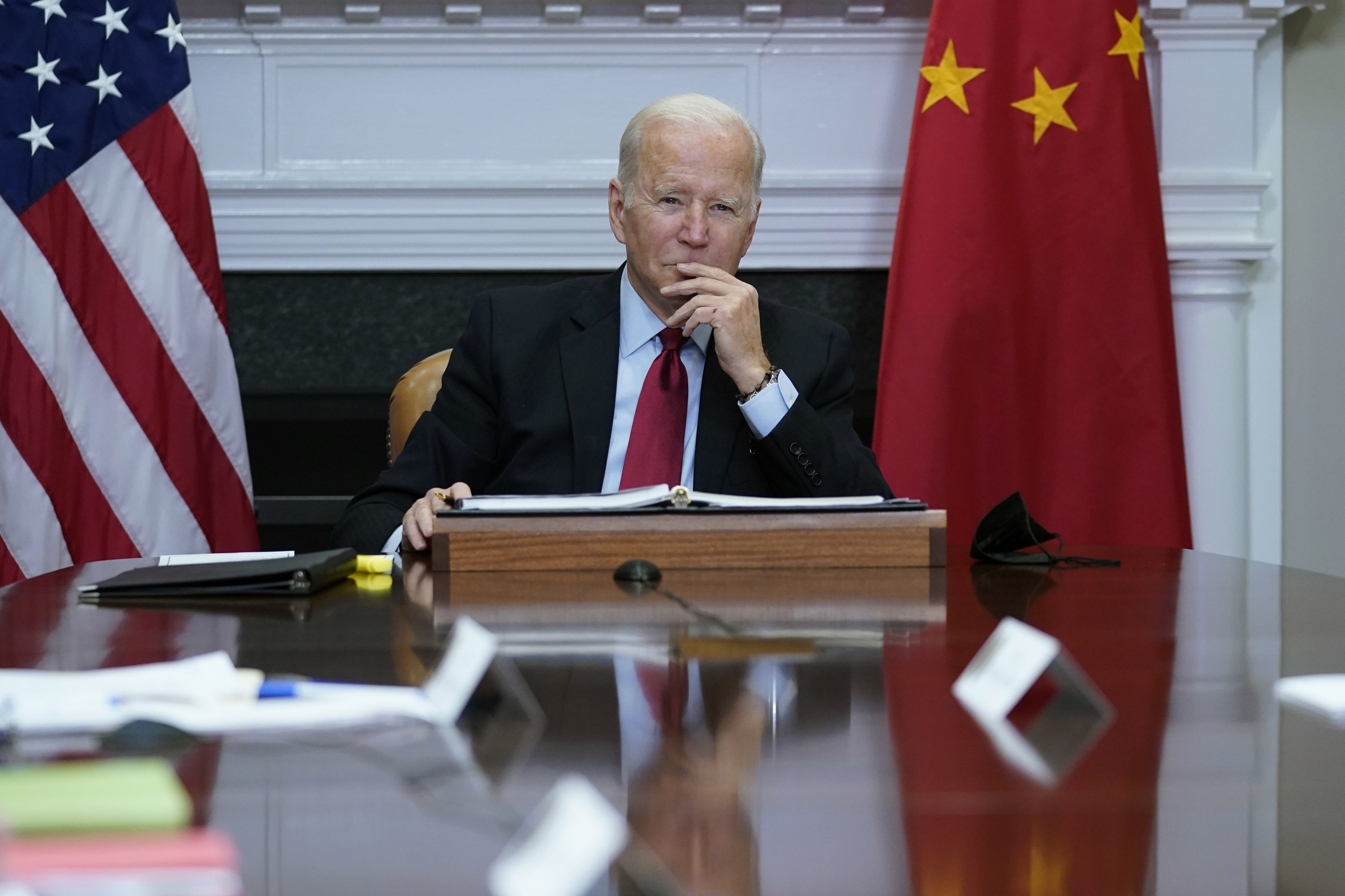 US President Joe Biden listens as he meets virtually with Chinese President Xi Jinping, in the Roosevelt Room of the White House in Washington, on November 15, 2021. Biden and his predecessor Donald Trump have both taken a hard line on China. Photo: AP 