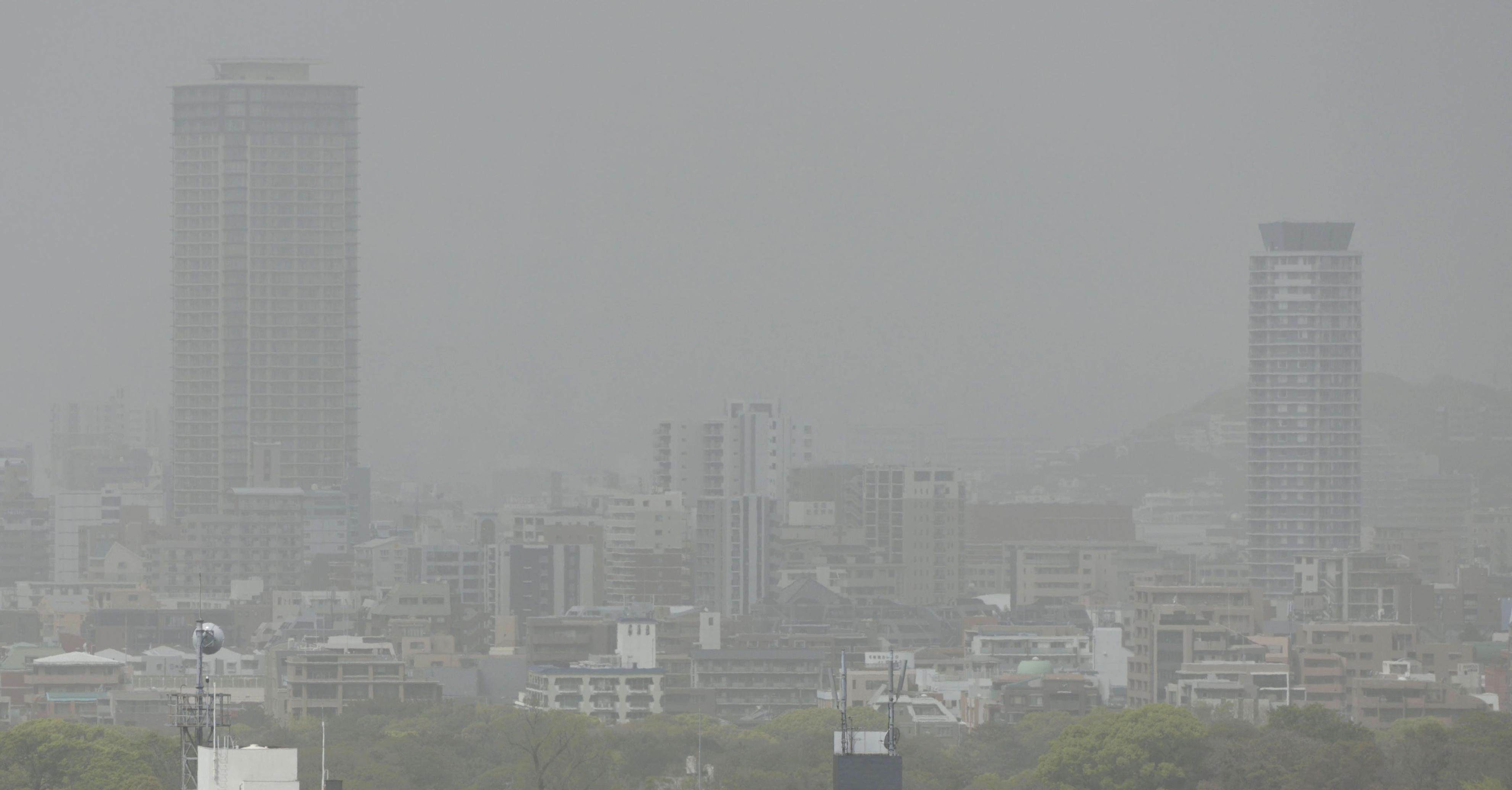 Dust from sandstorms darkens the sky over Fukuoka, southwestern Japan, on April 12. Photo: Kyodo