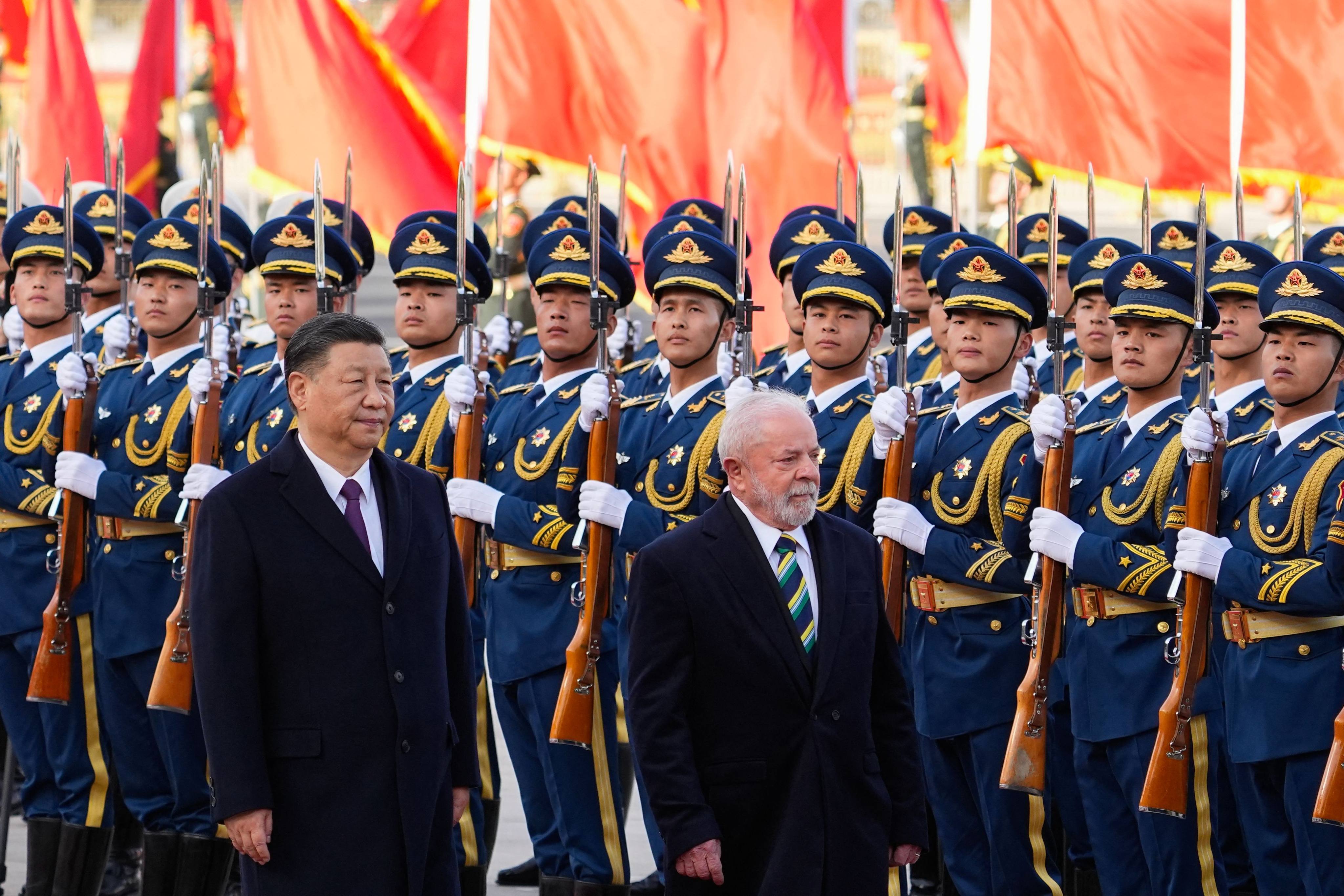 Chinese President Xi Jinping (left) and Brazilian President Luiz Inacio Lula da Silva attend a welcome ceremony at the Great Hall of the People in Beijing on Friday. Photo: AFP