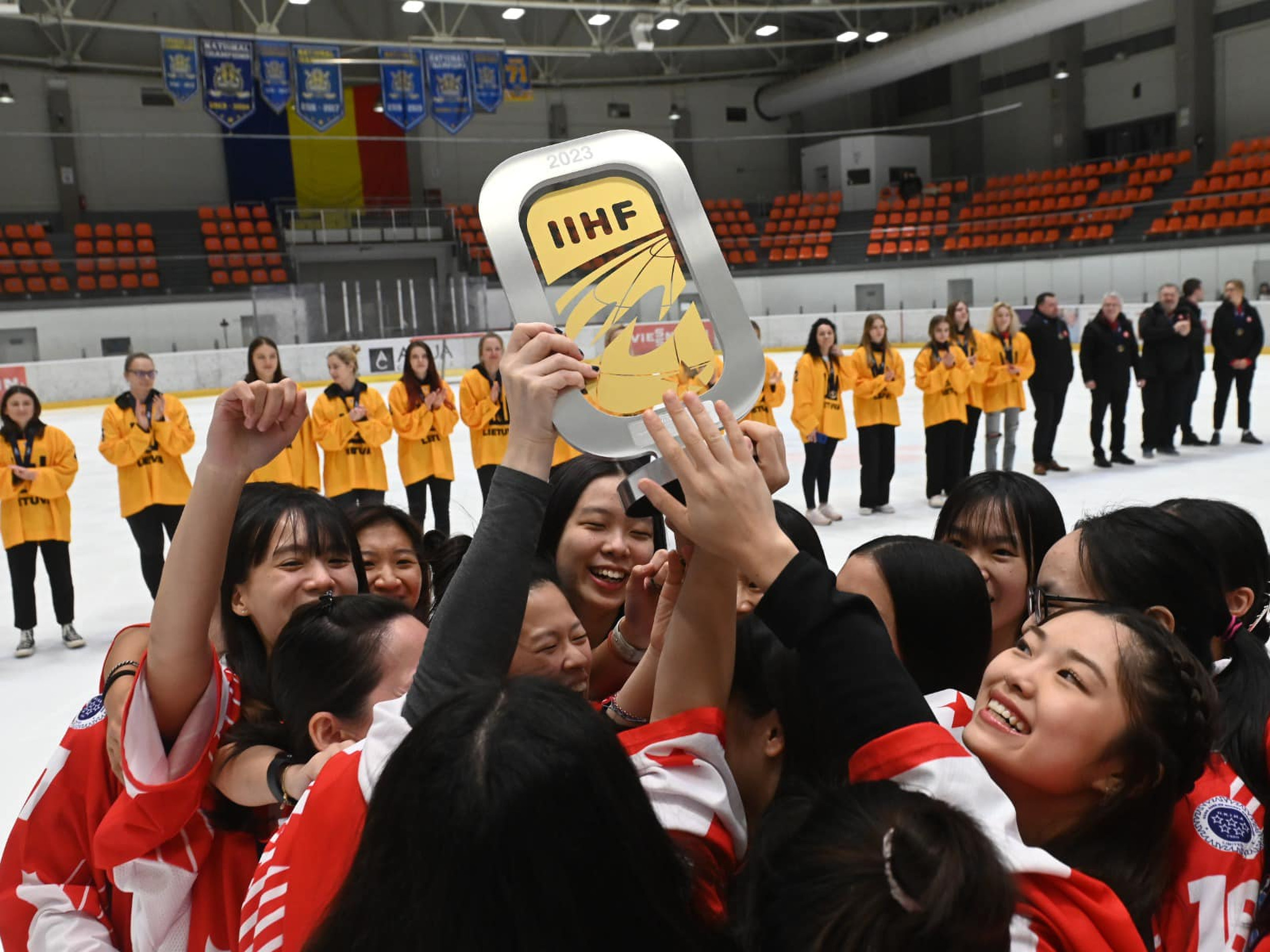 The Hong Kong women’s ice hockey team celebrate their recent gold medal. Photo: IIHF