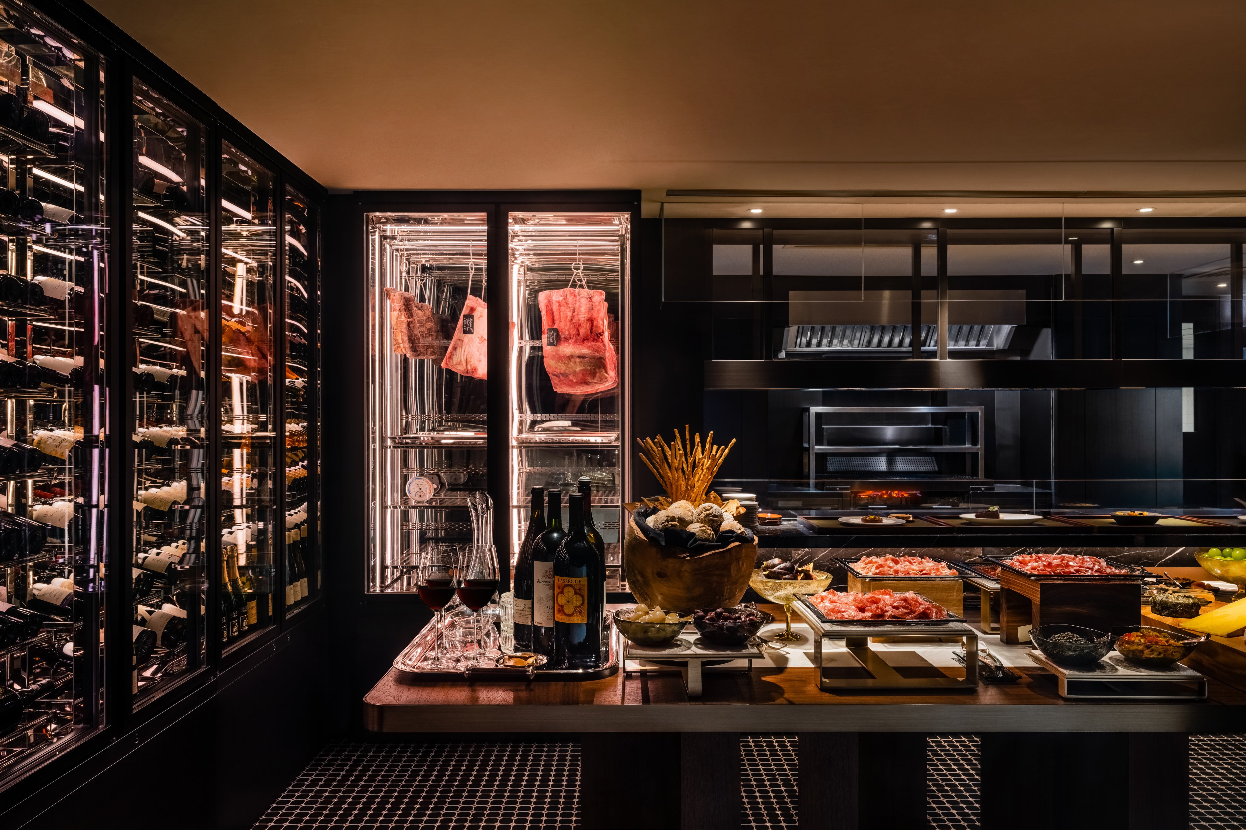 The Steak House at Regent Hong Kong’s open grill kitchen features its original charcoal grill and, as part of the stunning new design, houses the salad bar, dry age meat fridge, and wine cellar. Photos: Handout
