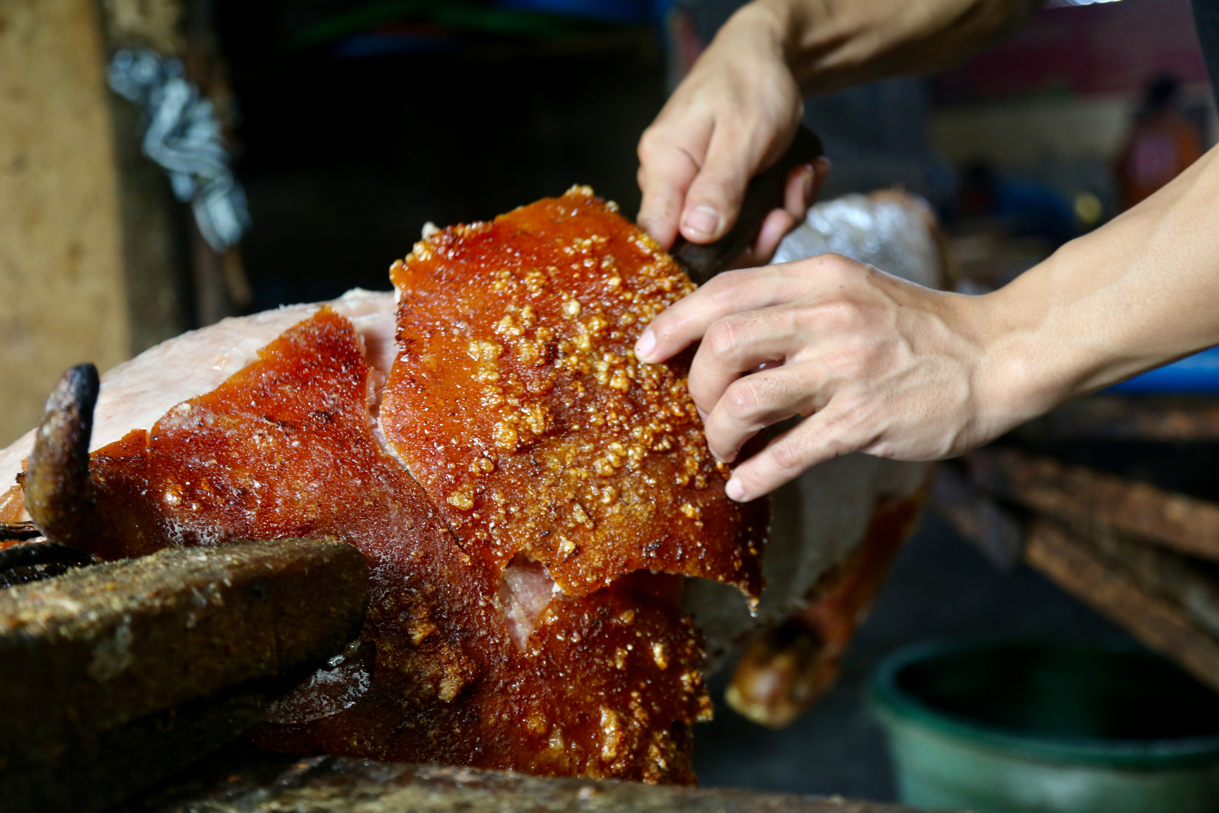 Carving spit-roasted pork at at Babi Guling Slingsing, in Pengayehan on Bali’s west coast. “Babi guling”, or turning pig was rated by late food legend Anthony Bourdain rated the most succulent pork he had ever had. Photo: Ian Lloyd Neubauer