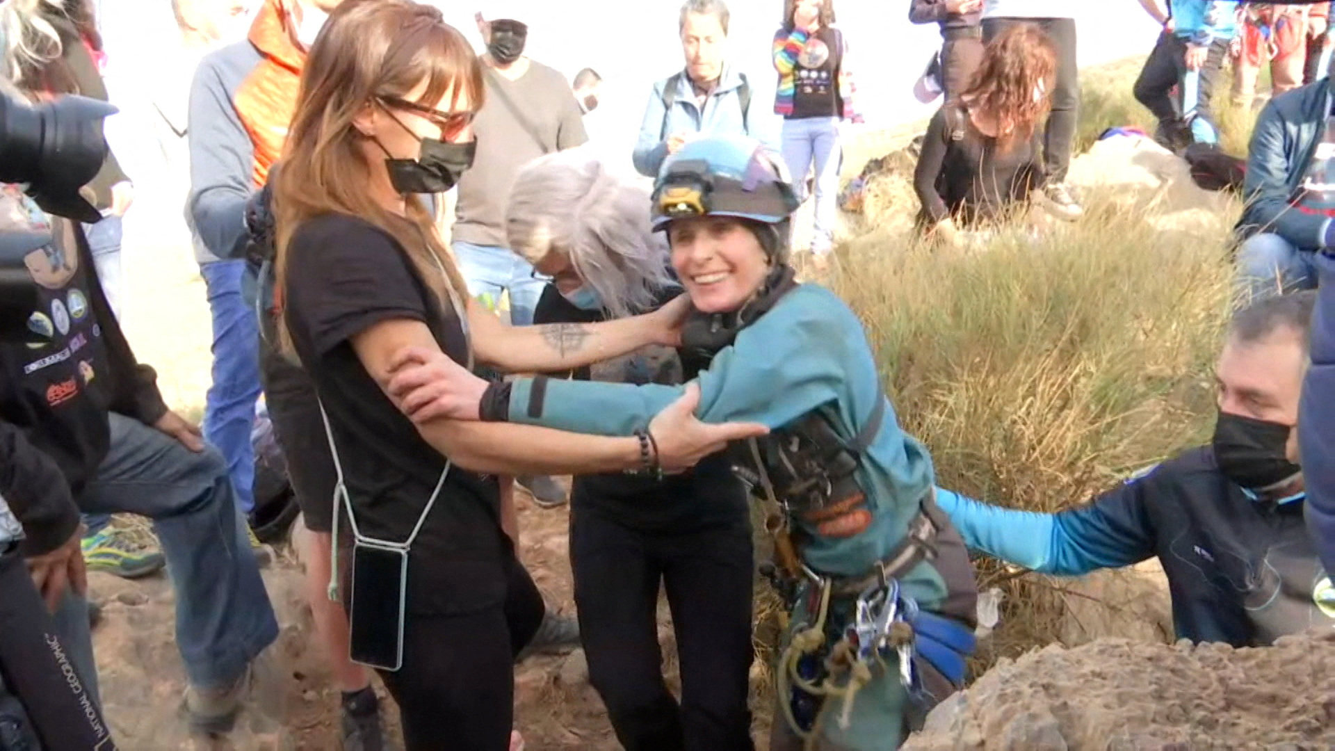 Beatriz Flamini, a Spanish mountaineer who has been isolated for 500 days in a cave in southern Spain, is greeted by teammates. Photo: Reuters