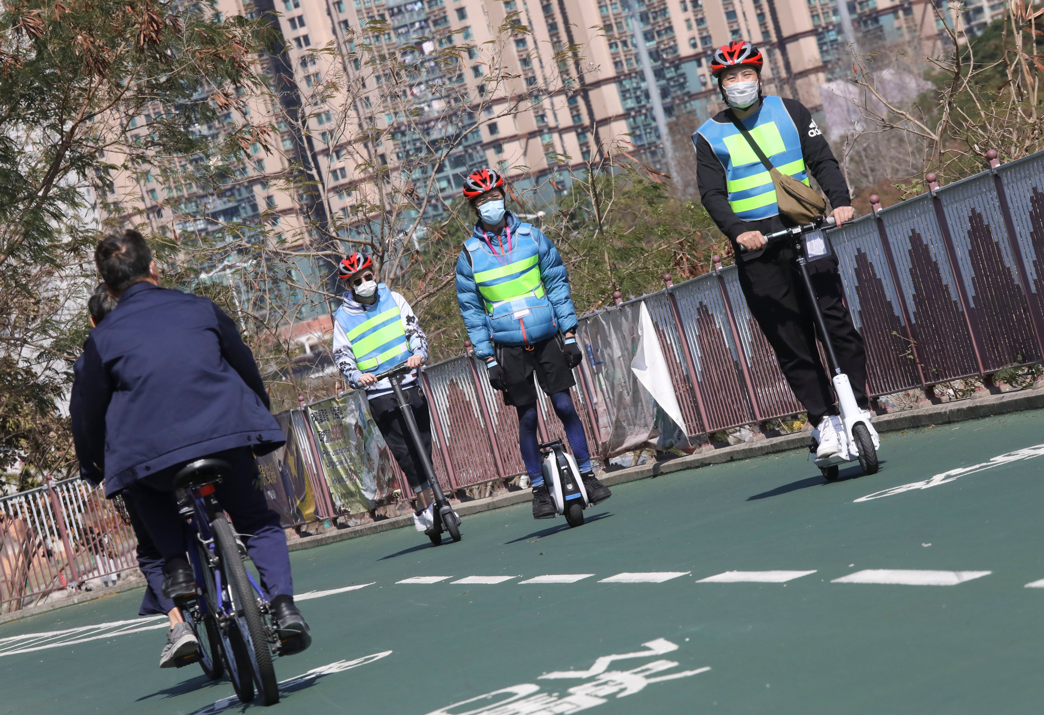 Staff of the Transport Department test safety requirements on the use of electric mobility devices at  Tseung Kwan O Waterfront Park. Photo: K.Y. Cheng