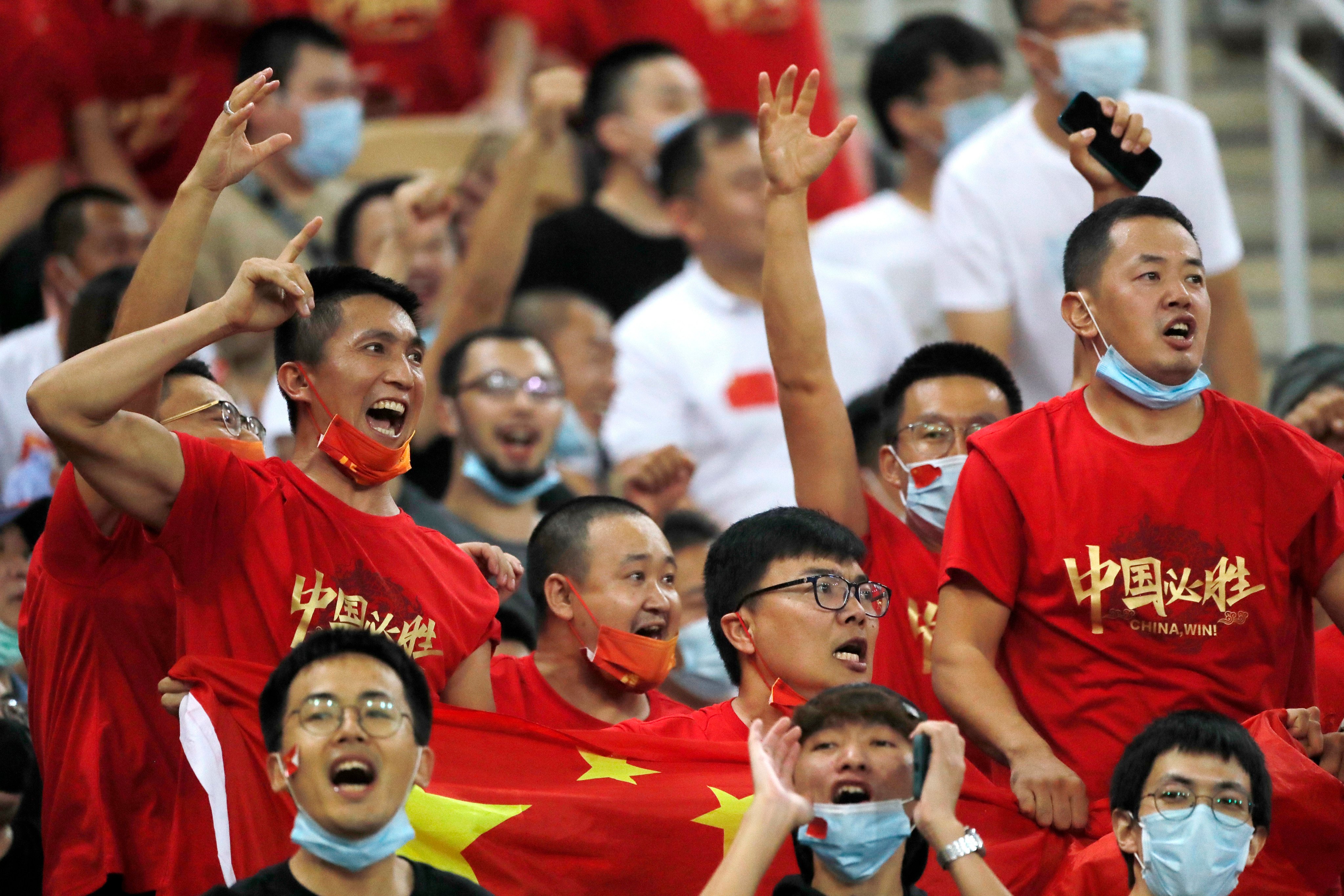 Chinese football fans watch the Fifa World Cup qualifier against Saudi Arabia at the King Abdullah Stadium in Jeddah. Photo: AP
