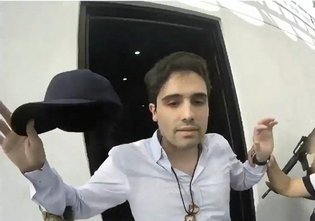 Ovidio Guzman, son of jailed drug kingpin El Chapo, is seen being arrested in footage released in October 2019. Photo: Mexican Government’s Production Centre for Informative and Special Programmes via AFP