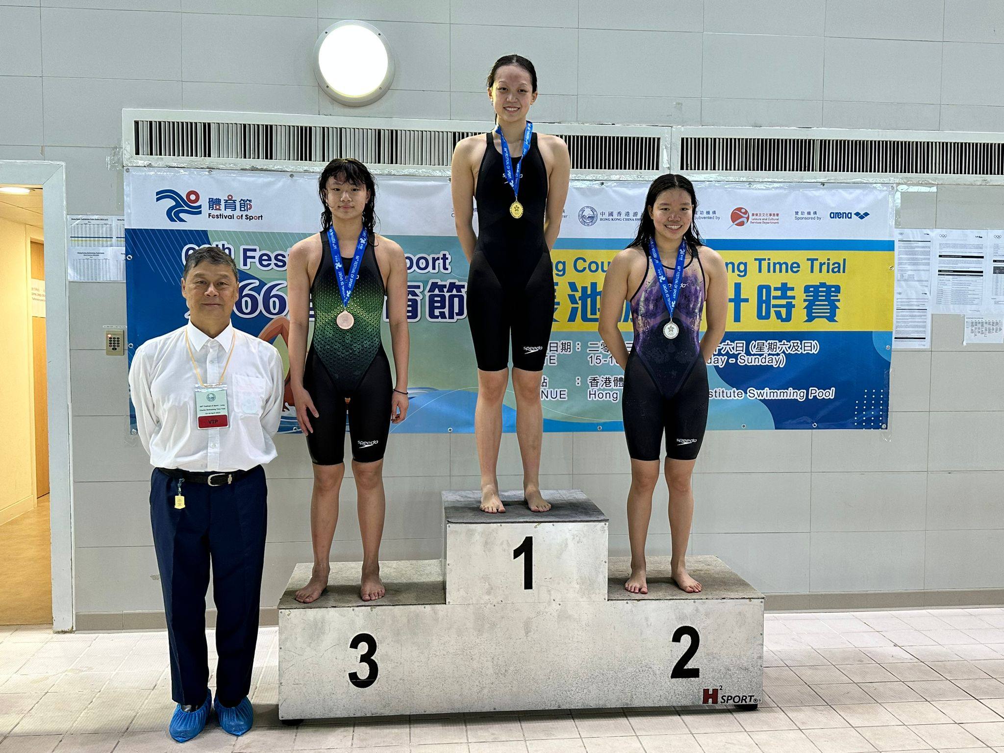 Cindy Cheung, 16, stands atop the podium after winning the 200m backstroke at the Long Course Time Trial. Photo: Swimming Association 
