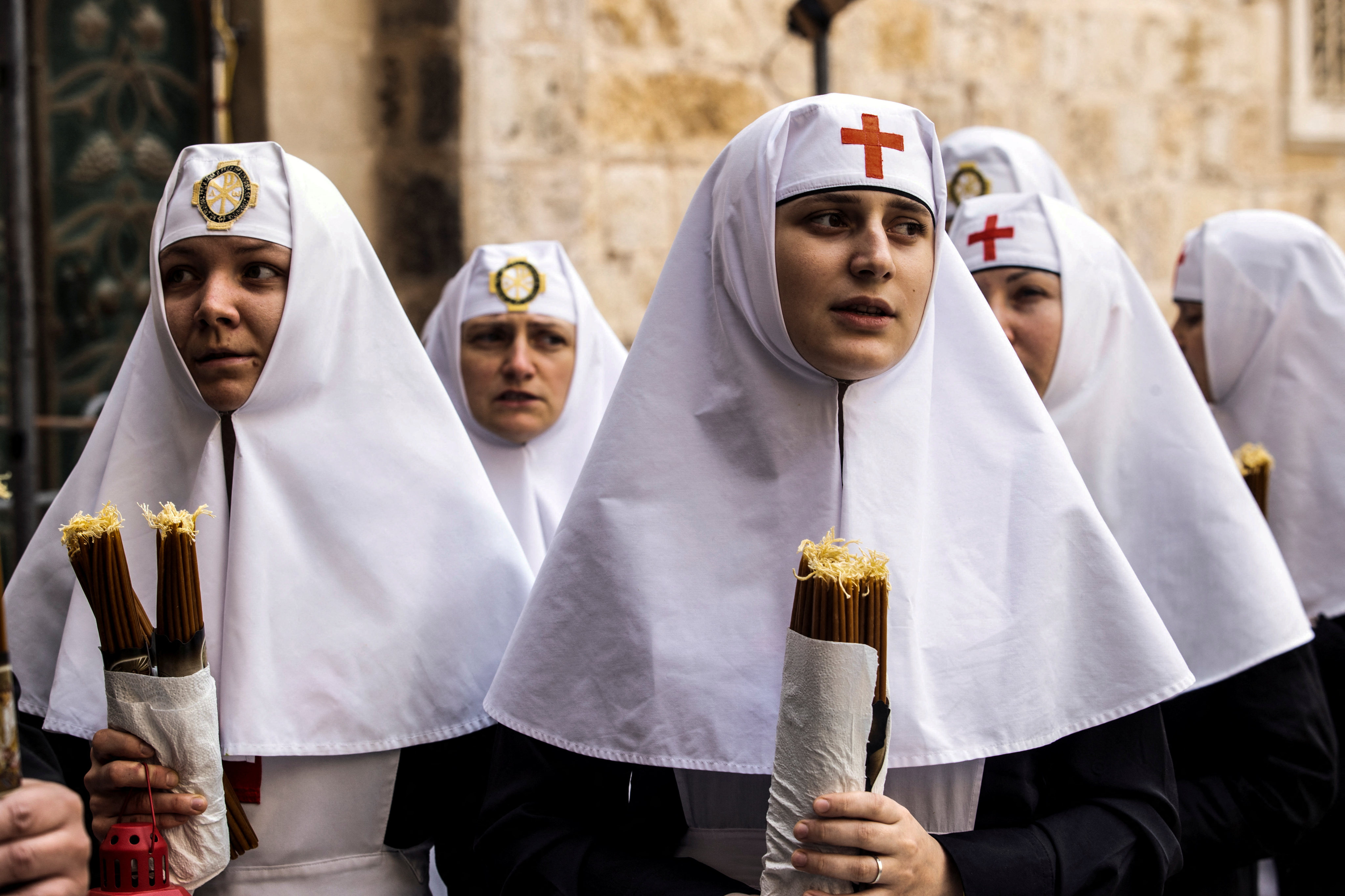 Nuns hold candles as Orthodox Christian worshippers attend the Holy Fire ceremony at the Church of the Holy Sepulchre in Jerusalem’s Old City on Saturday. Photo: Reuters