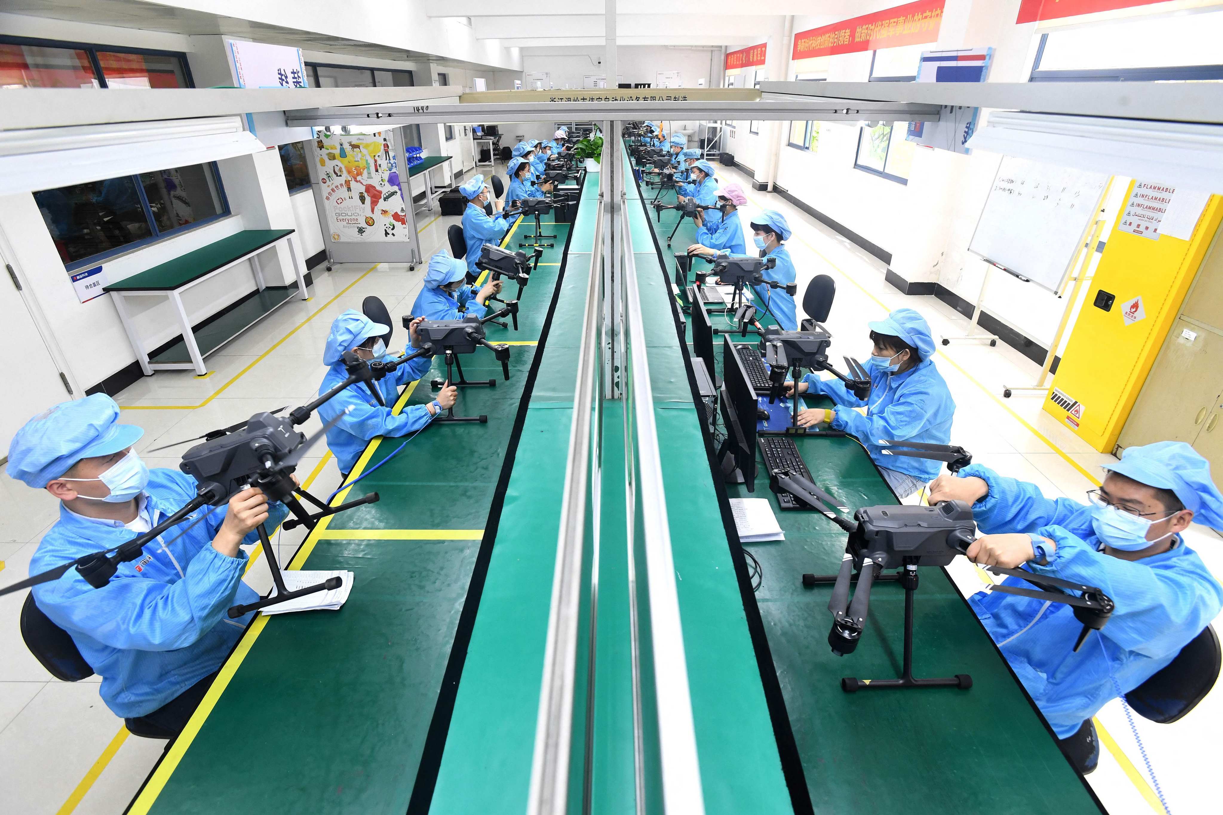Workers produce drones at a factory in Wuhan, in central Hubei province, on April 13. After years of prioritising rapid growth above all else in national policy, China’s government is shifting its focus to jobs and macroeconomic stability. Photo: AFP