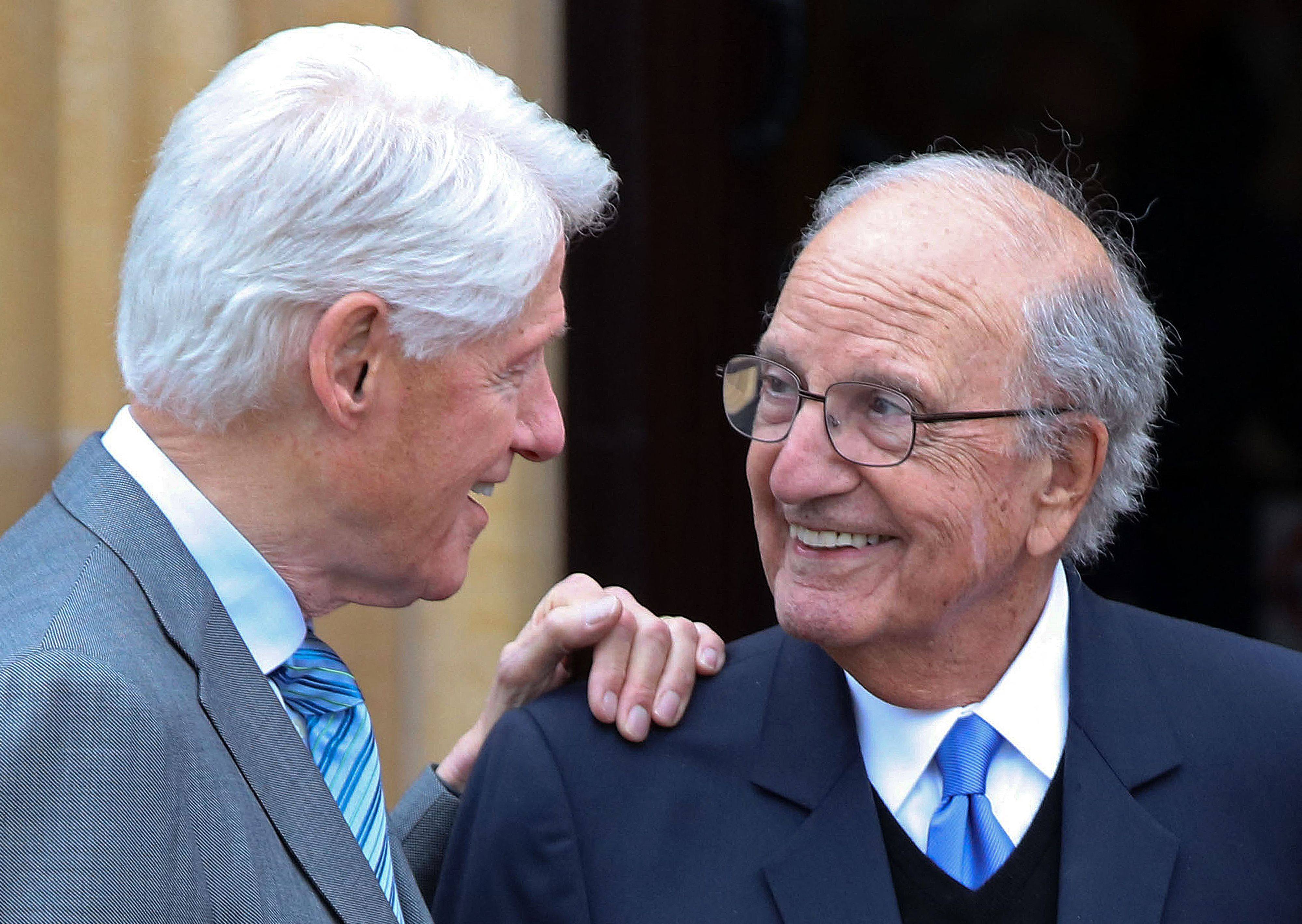 Former US President Bill Clinton (left) with former US Senator George Mitchell in Belfast on Monday, the first day of a three-day conference to mark the 25th anniversary of the Good Friday Agreement. Photo: AFP