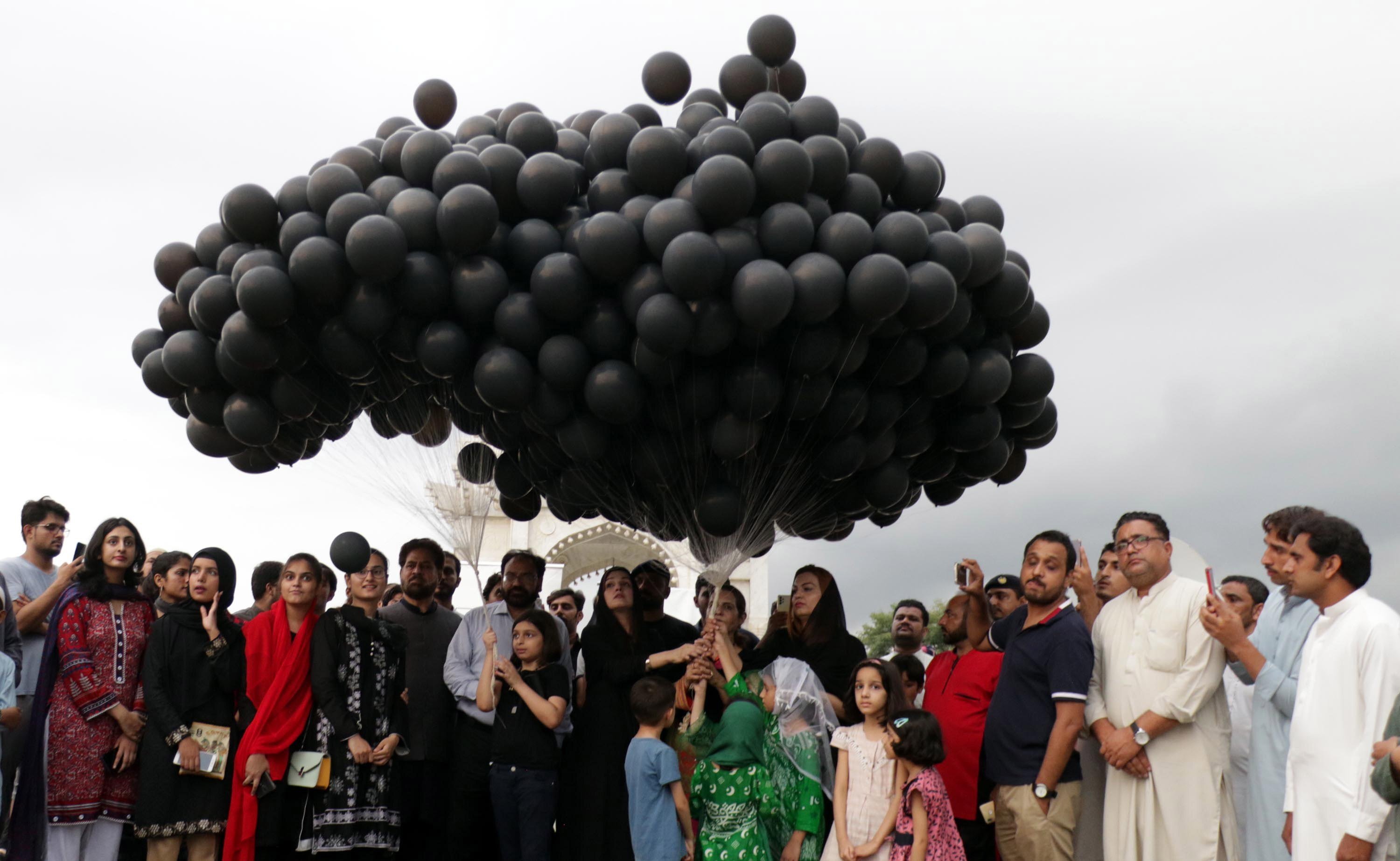 People release black balloons to protest against alleged Indian aggression in Indian-administered Kashmir on India’s Independence Day, in Islamabad, Pakistan, on August 15 last year. Pakistan and India have fought two of their three wars over Kashmir. Photo: EPA-EFE