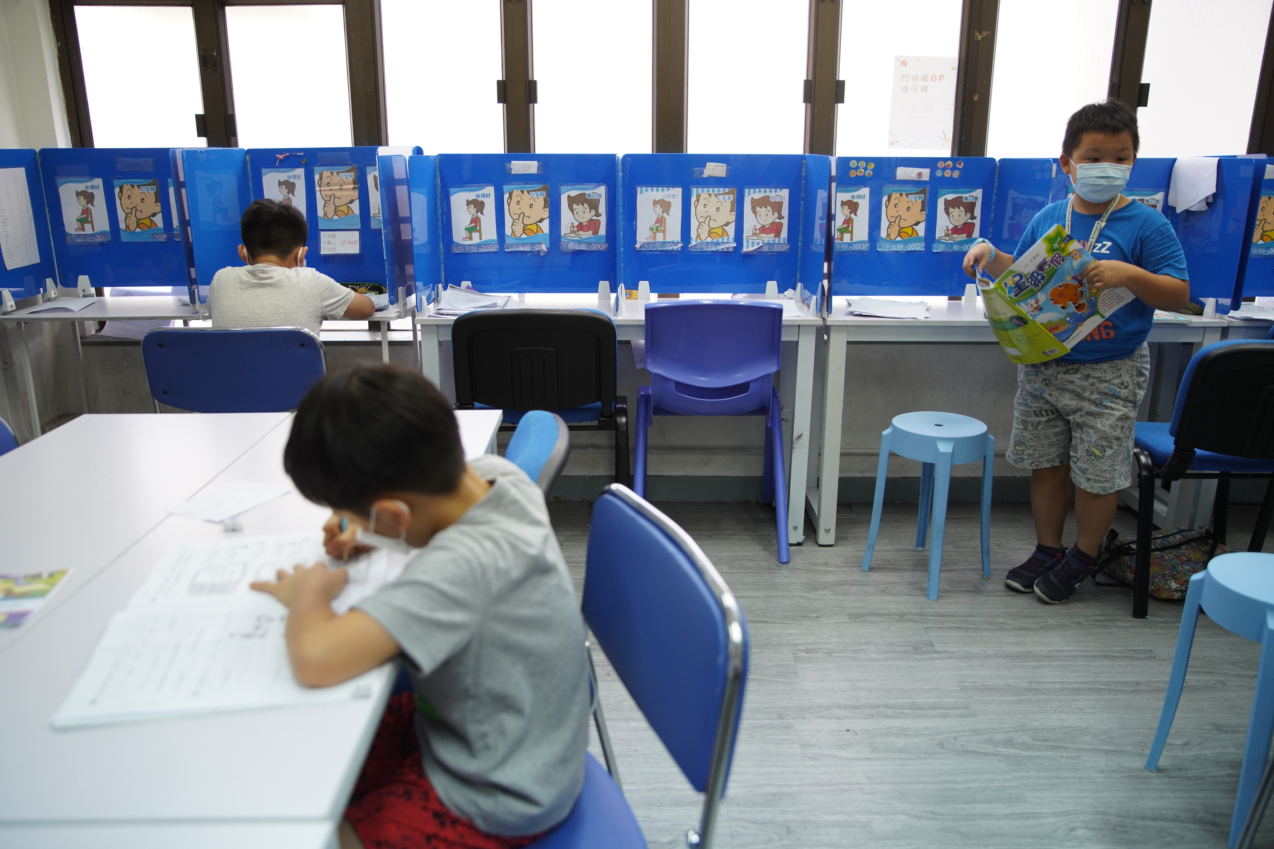 Children read and do their homework at a tutorial centre in Aberdeen, Hong Kong, on July 13, 2020. Incorporating generative AI into the classroom could help improve the outcomes of students who have no access to private tutoring. Photo: Winson Wong