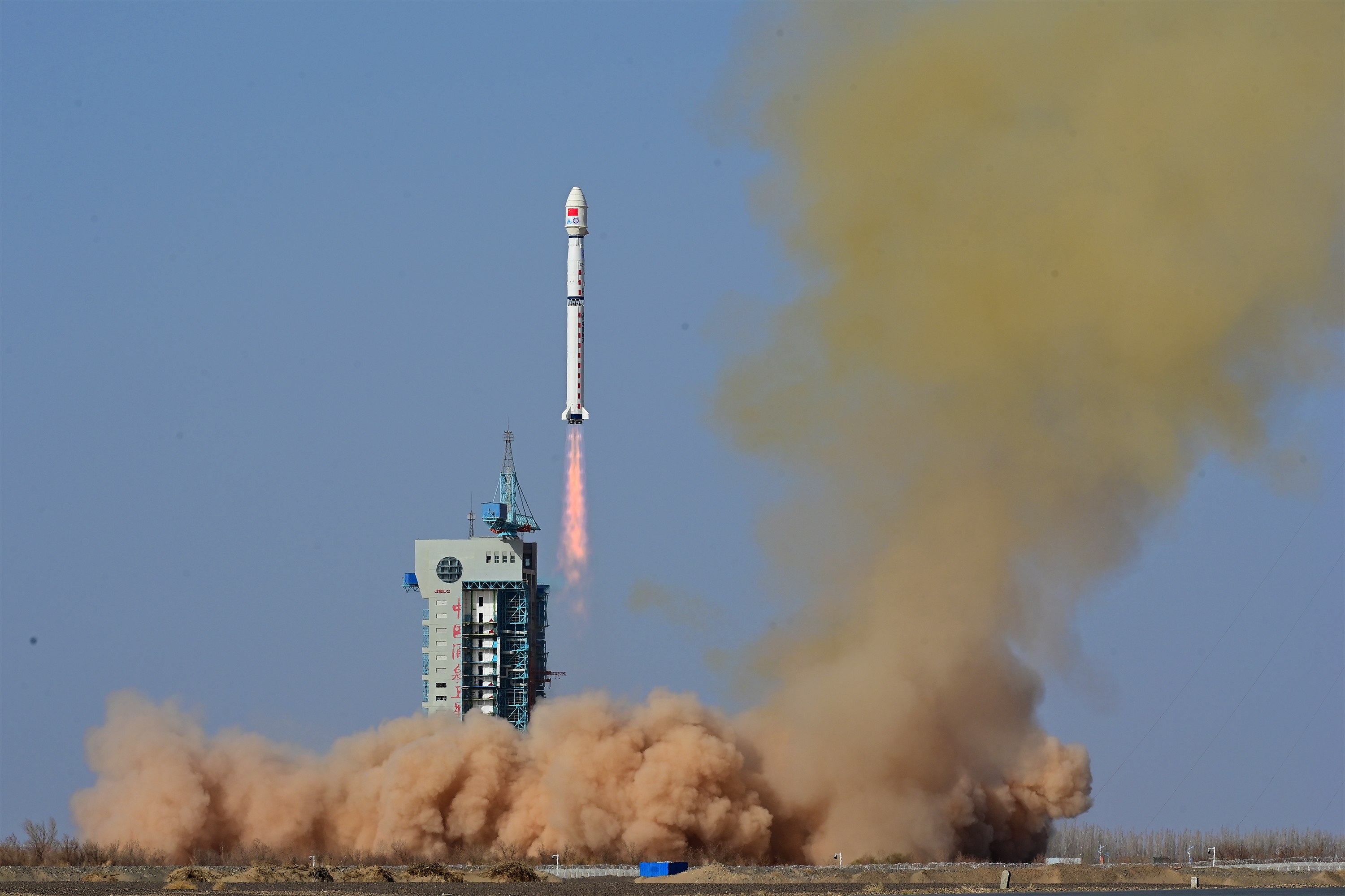 A Long March-4B rocket carrying a satellite blasts off from a space centre in Jiuquan, China on Sunday. Photo: Xinhua/EPA-EFE