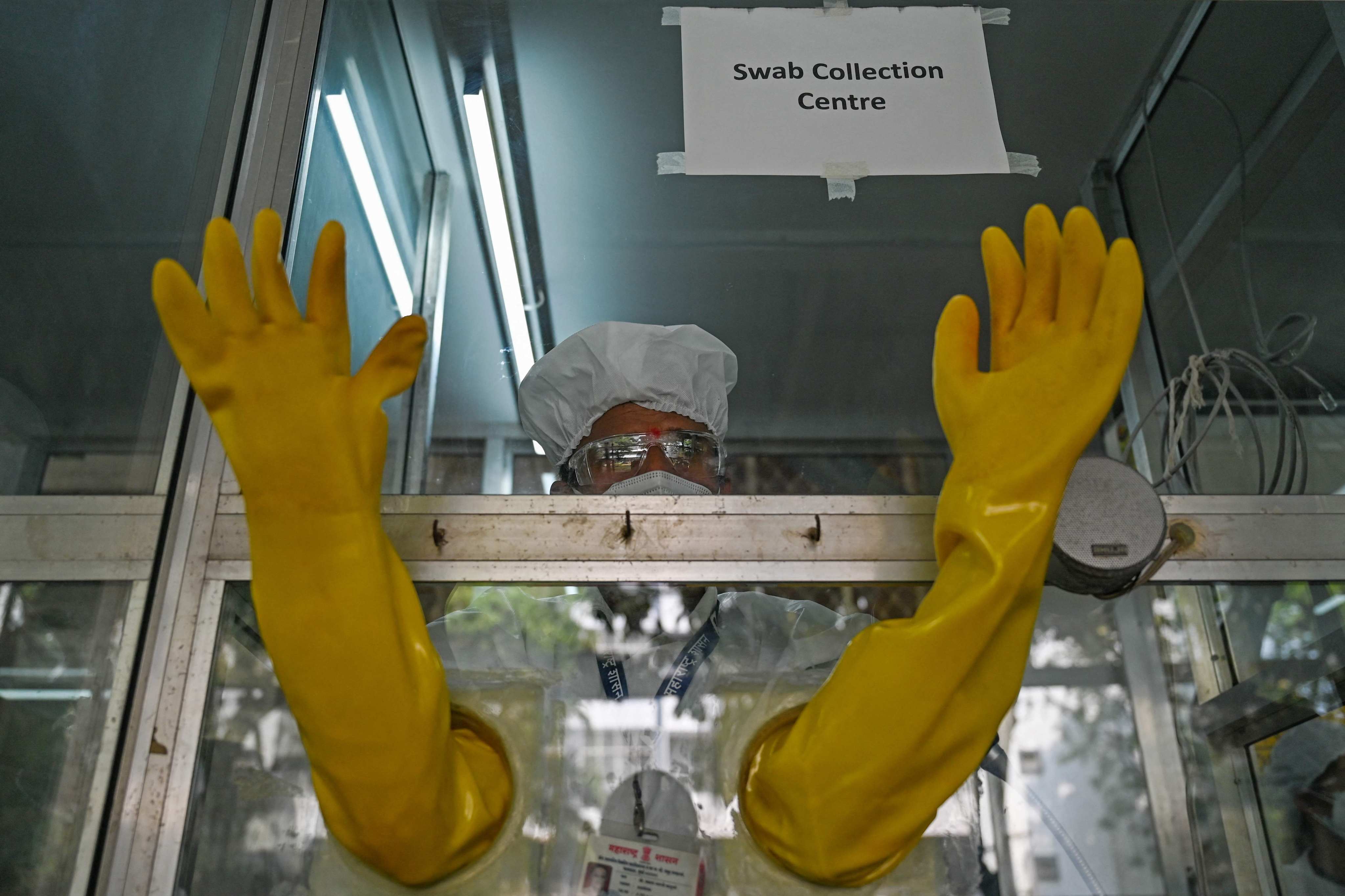 A health worker takes part in a mock drill to check preparations of Covid-19 facilities at a hospital in Mumbai, India. Photo: AFP