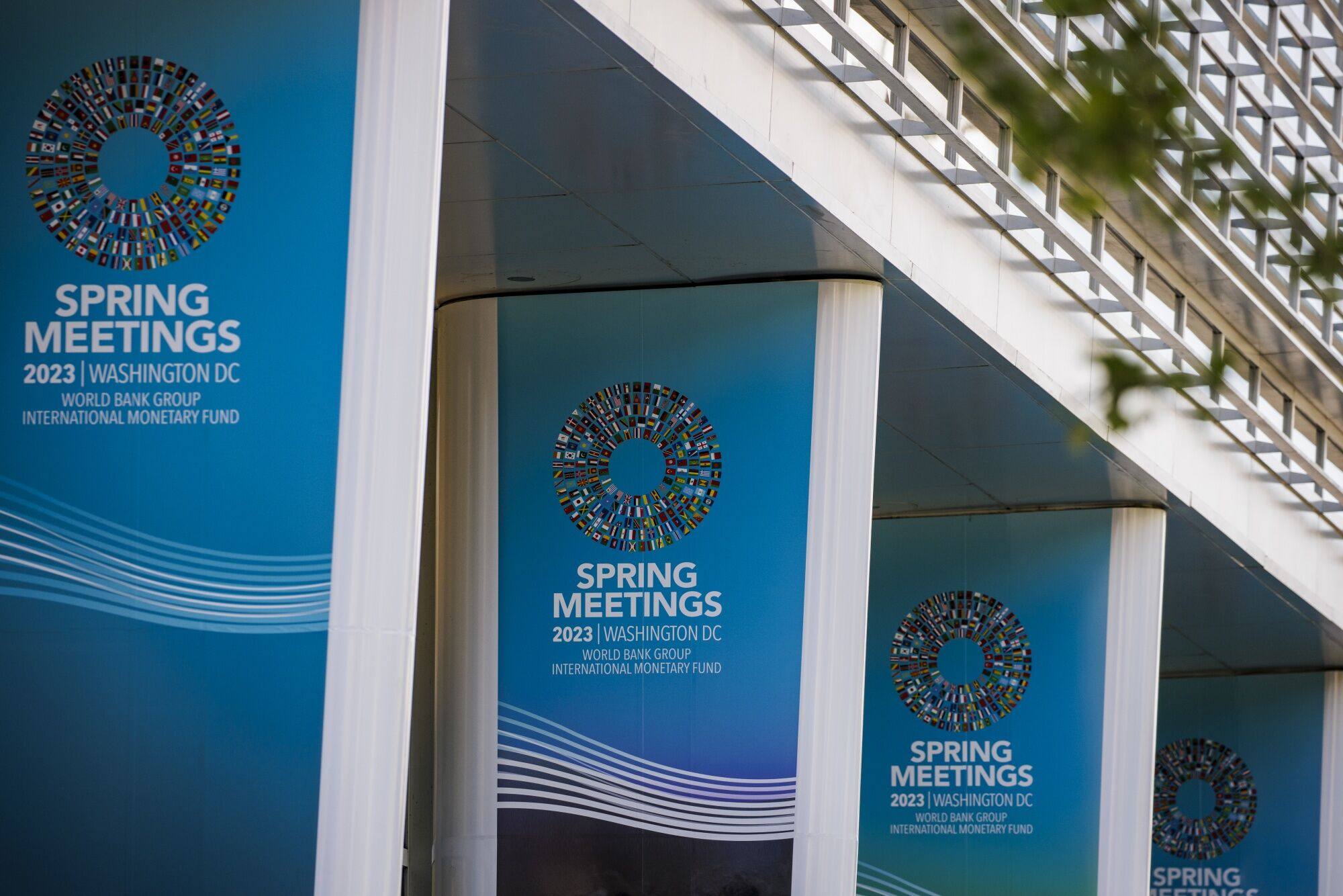 IMF and World Bank spring meetings signs outside the IMF headquarters in Washington on April 11. It’s a waiting game with debt restructuring as no creditor wants to be the first to make a deal and risk agreeing to less onerous terms than the banks that follow. Photo: Bloomberg