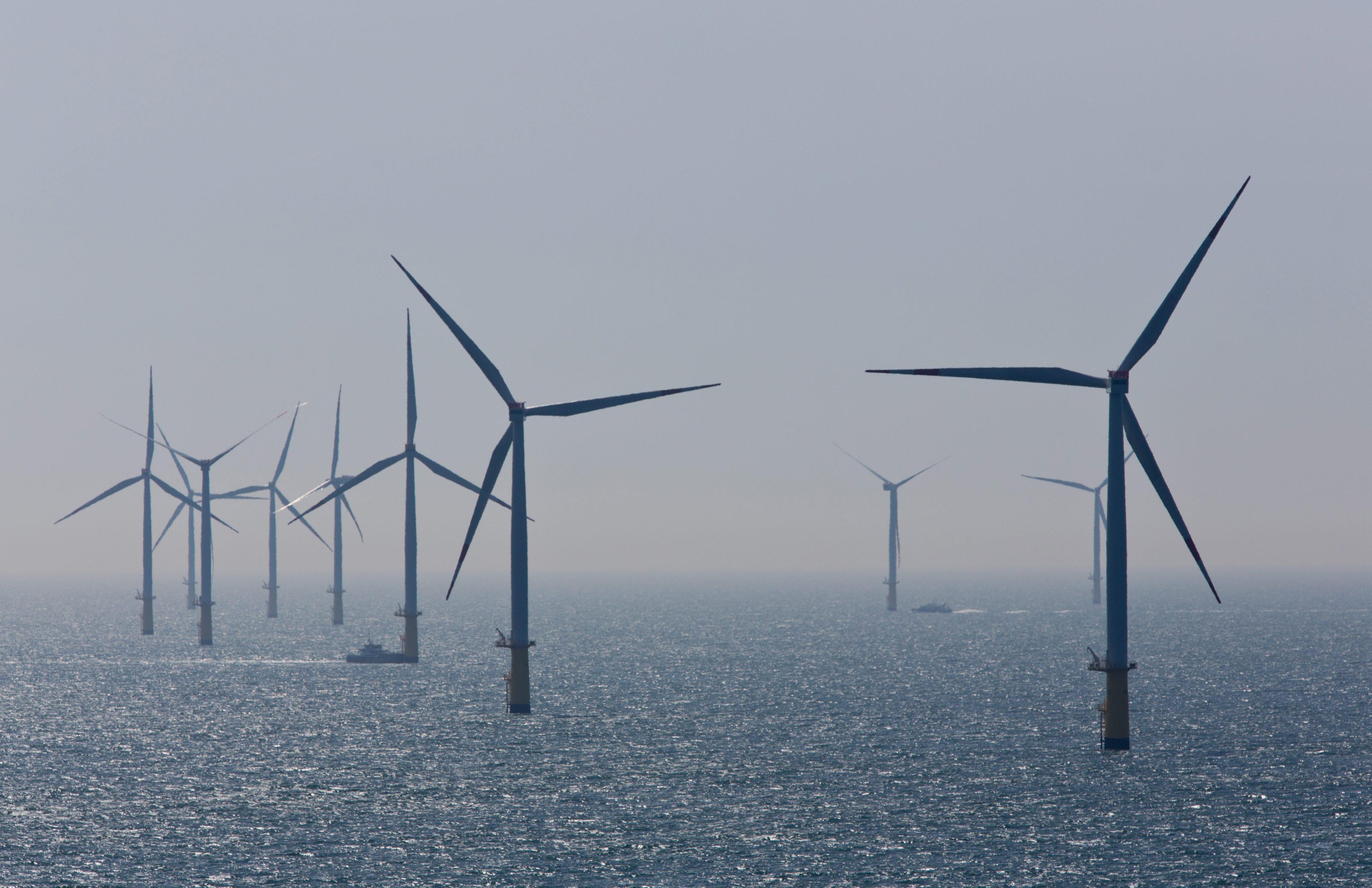 Wind turbines rotate in the North Sea near Helgoland, Germany in May 2015. Photo: EPA