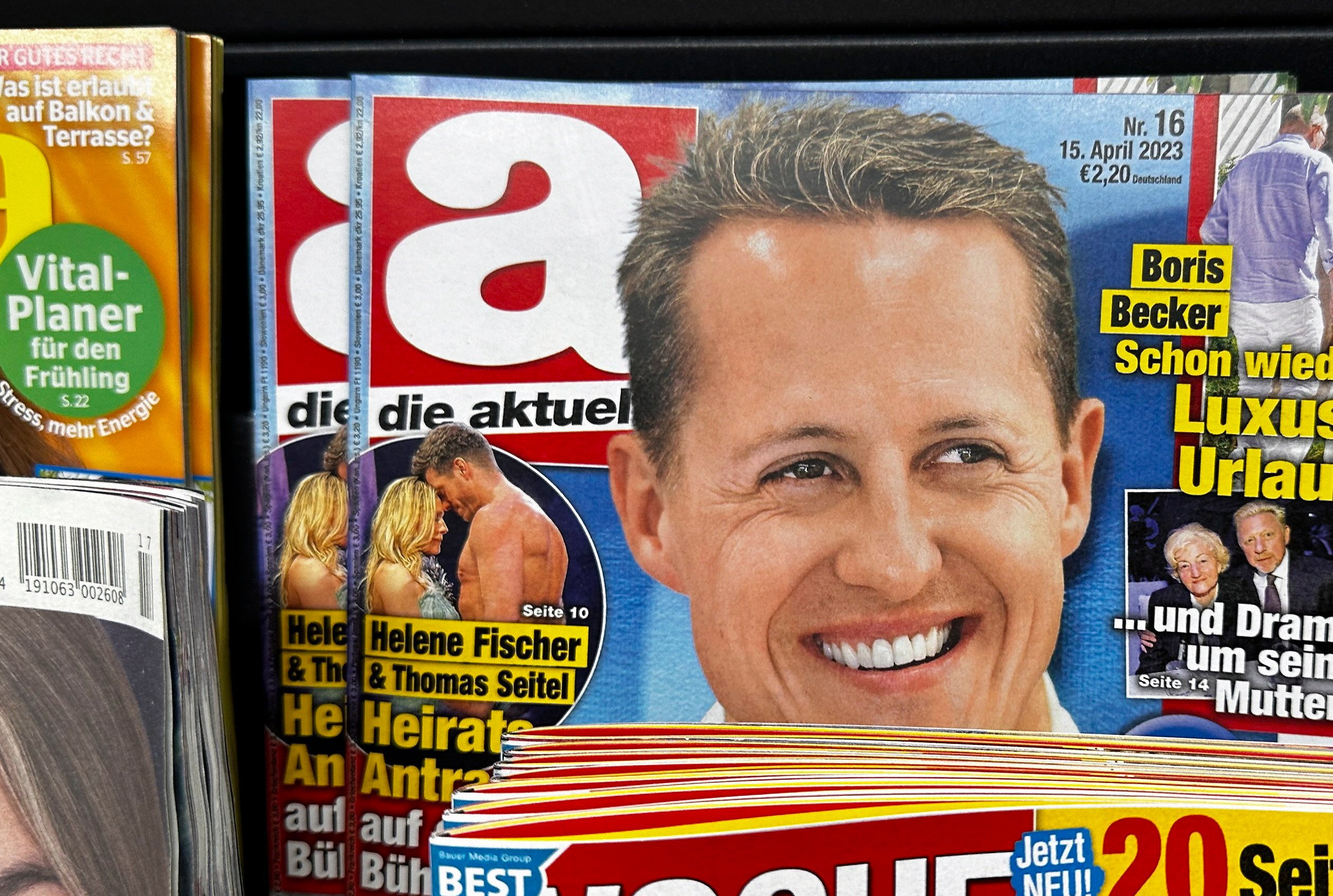 Copies of the edition of German weekly magazine Die Aktuelle with the cover announcing a fake interview with Michael Schumacher sit on a shelf at a news agent in Berlin. Photo: EPA-EFE