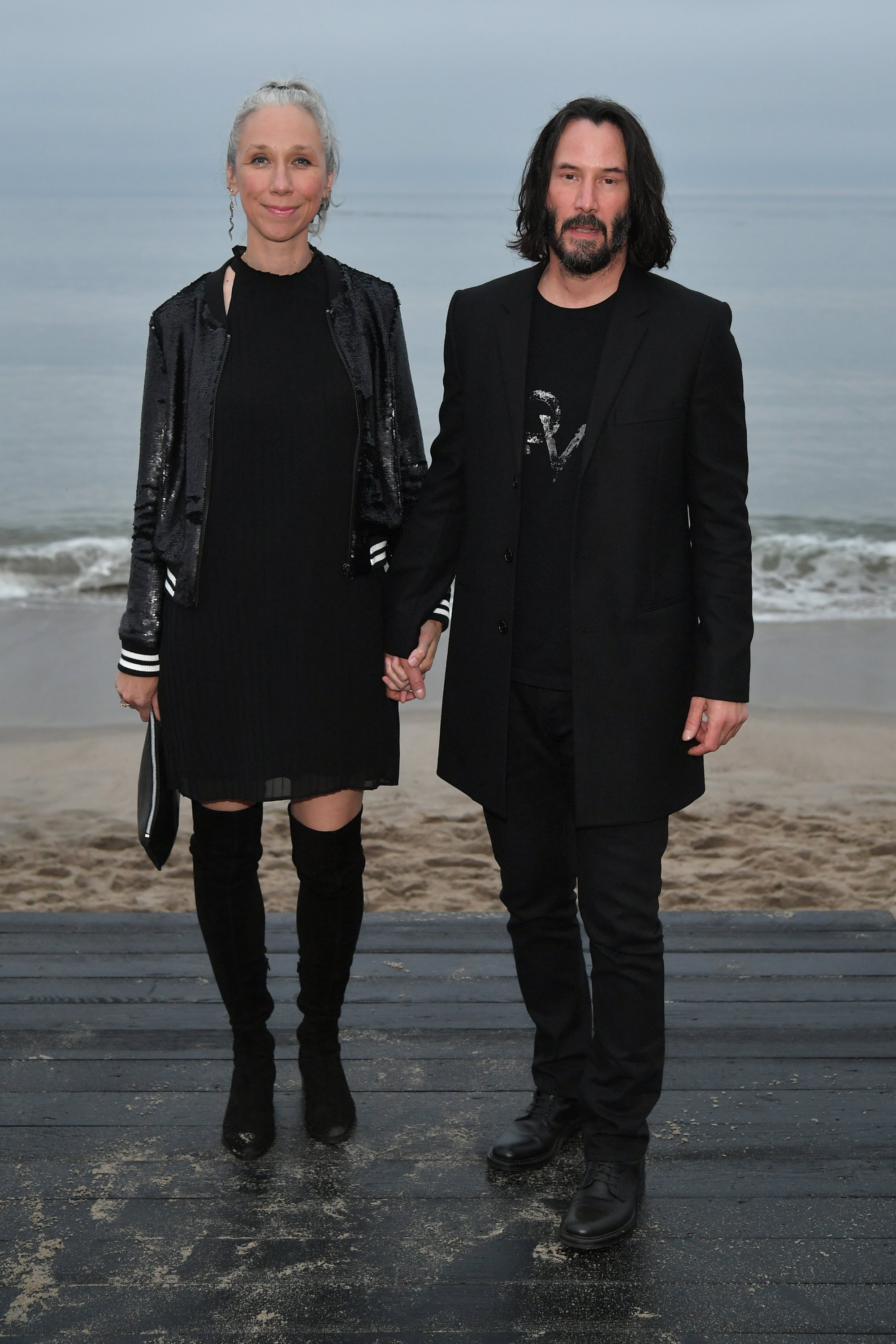 Alexandra Grant and Keanu Reeves at a Saint Laurent show in June 2019. Photo: Getty Images