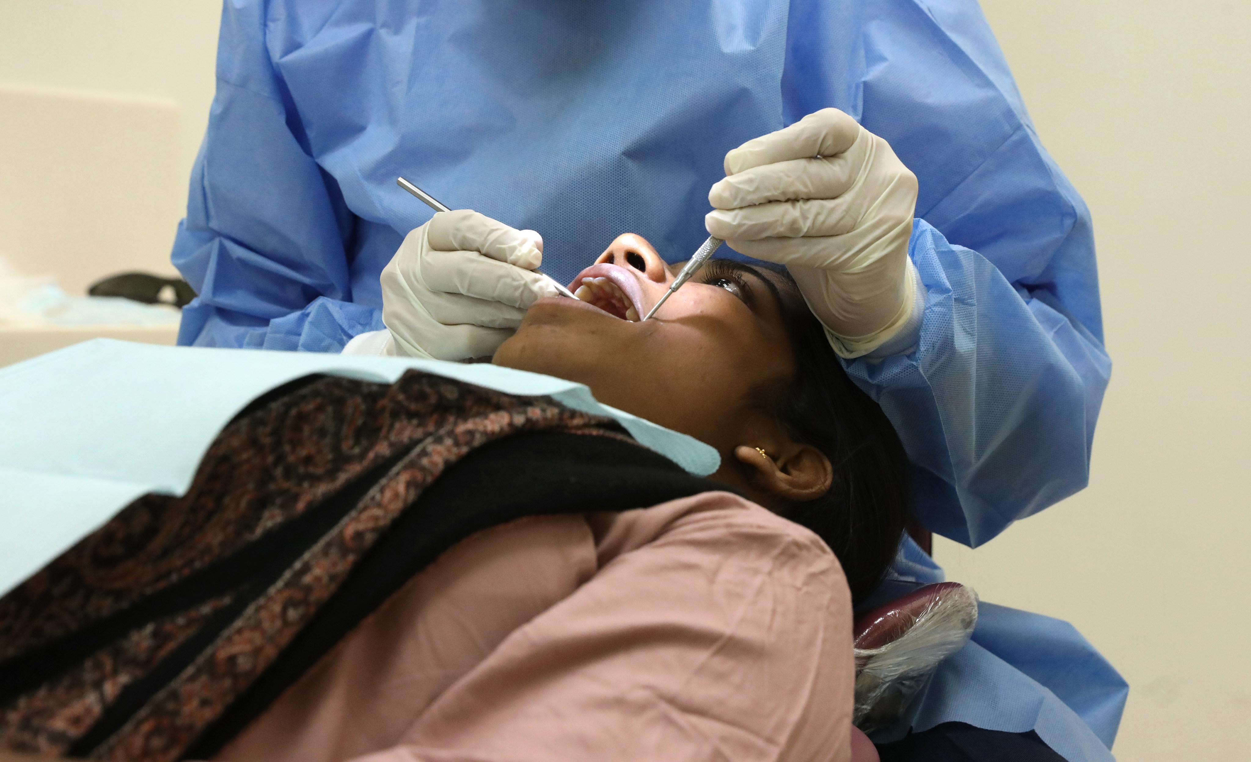 A dentist attends to a patient at the Prince Philip Dental Hospital in Sai Ying Pun in 2020. Photo: K.Y. Cheng