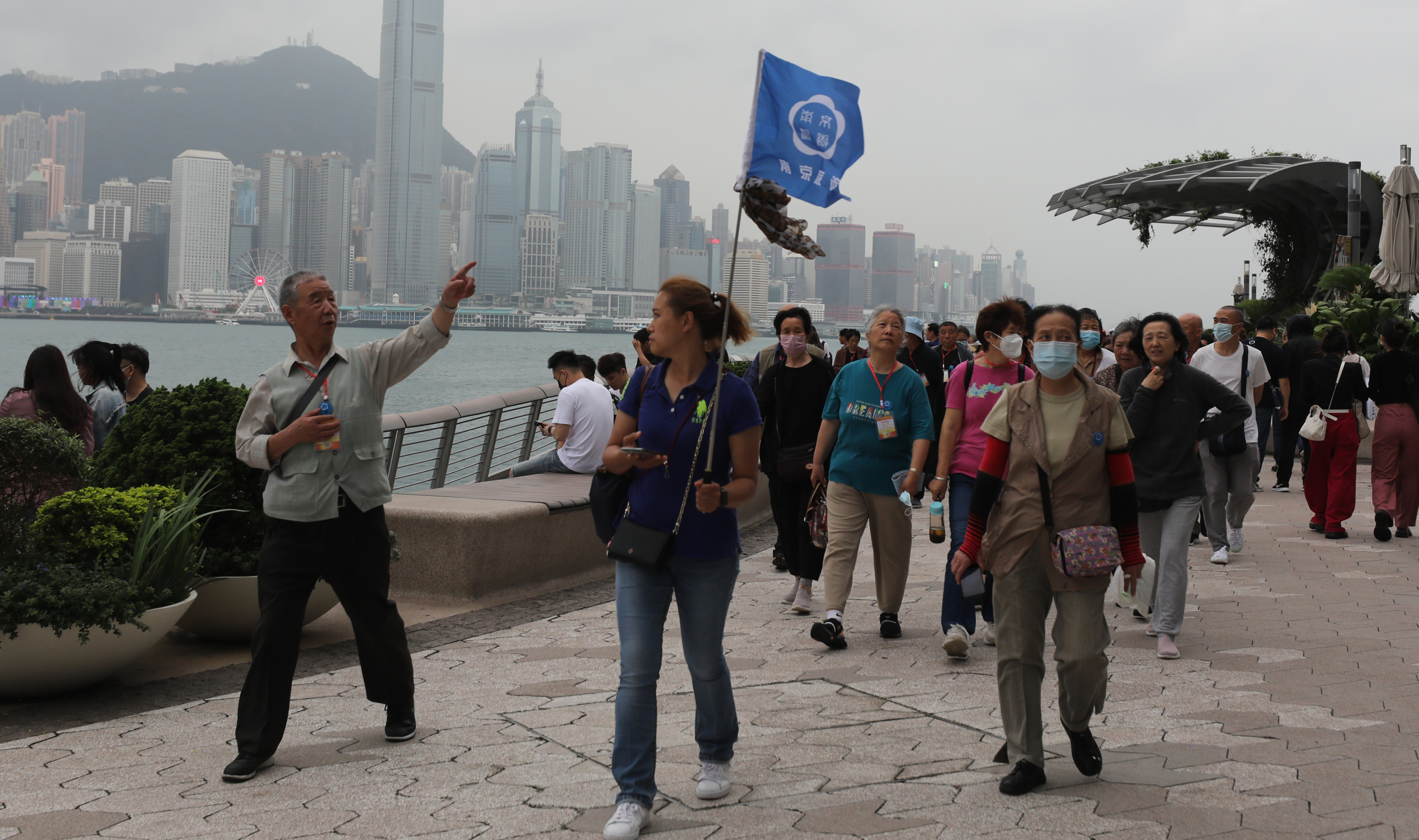 Tourist take a walk along the waterfront in Tsim Sha Tsui. Photo: Xiaomei Chen