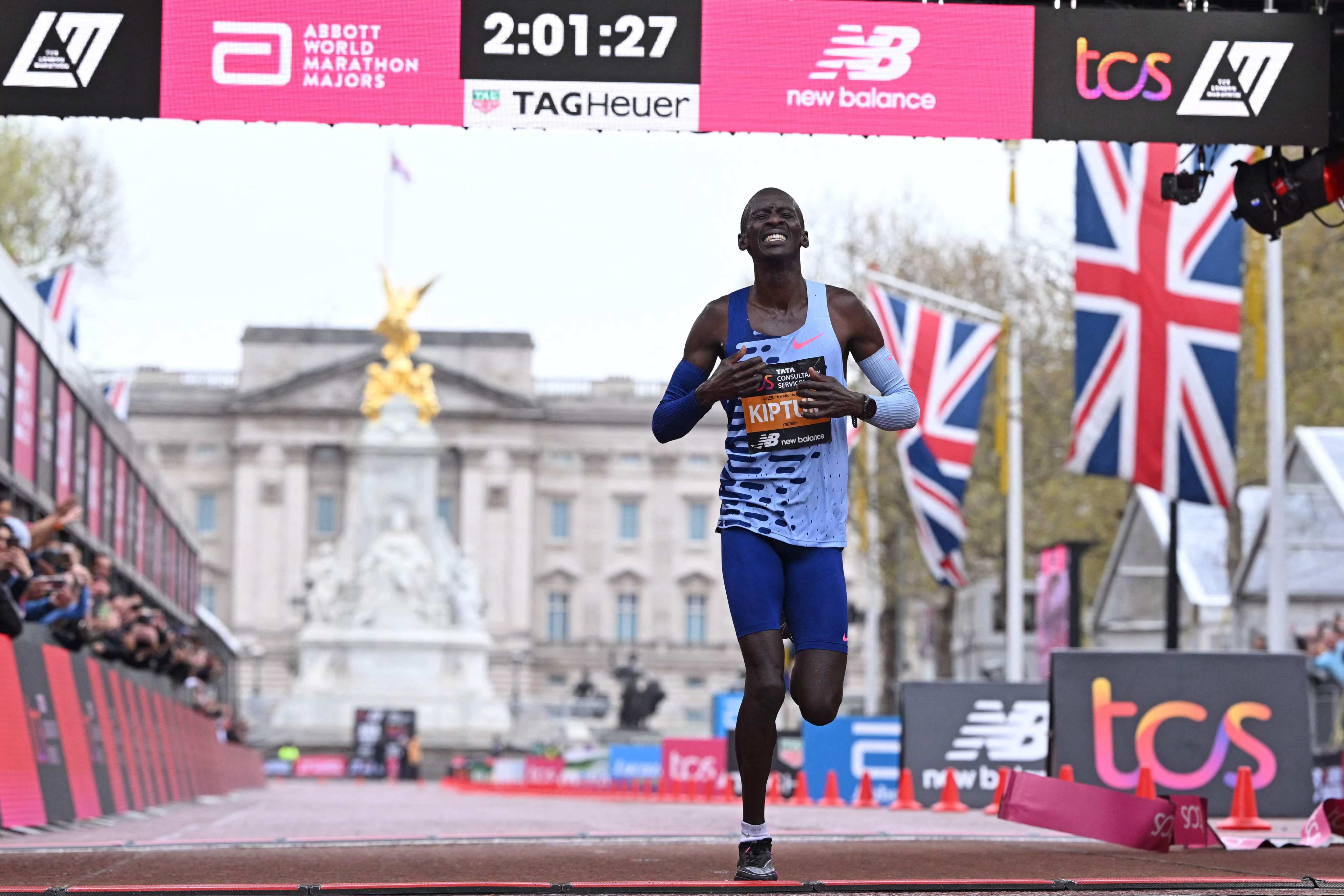 Kenya’s Kelvin Kiptum breaks the tape to win the men’s race at the 2023 London Marathon. Photo: AFP