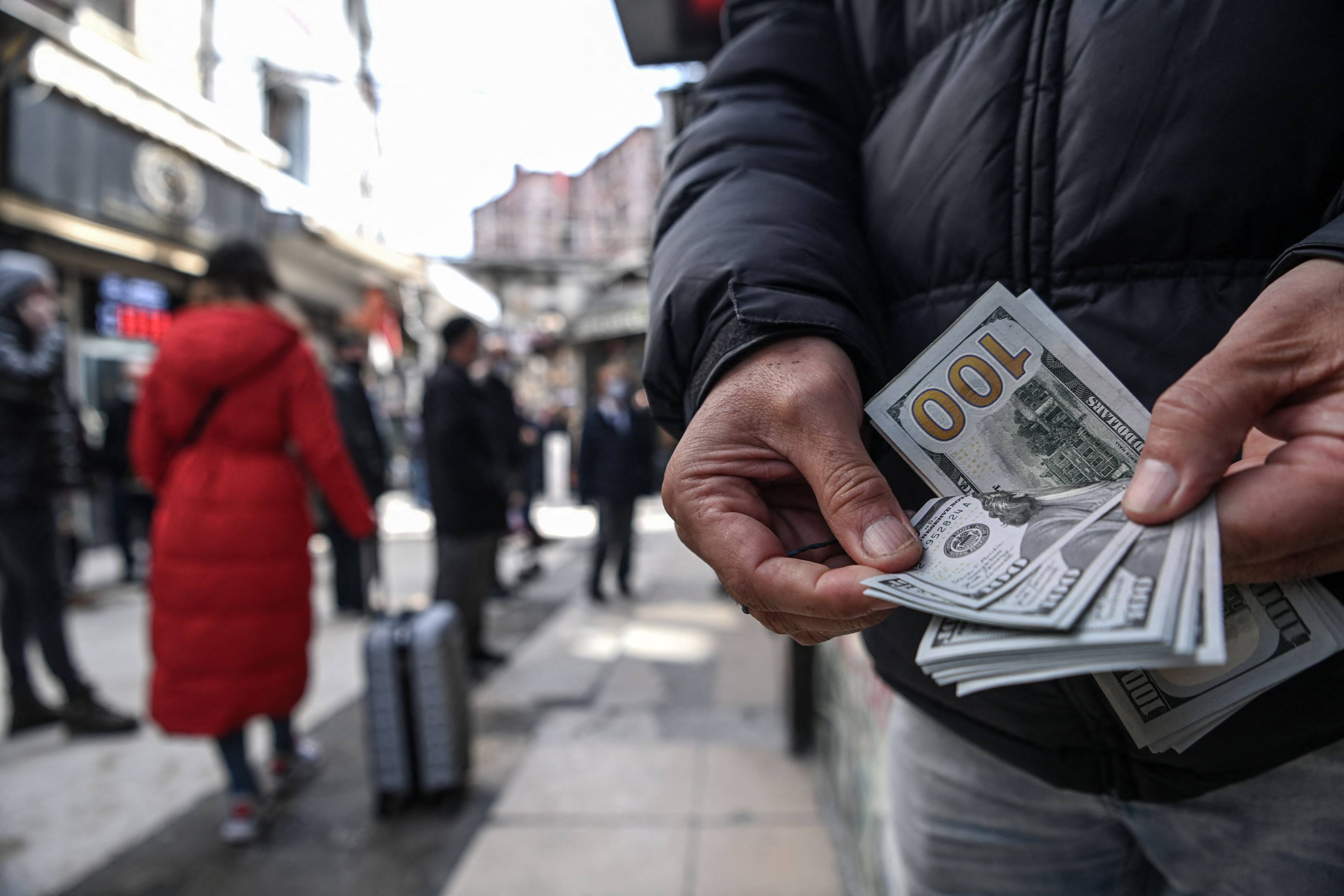 Professional investors are negative on the dollar, a survey showed. Photo: AFP
