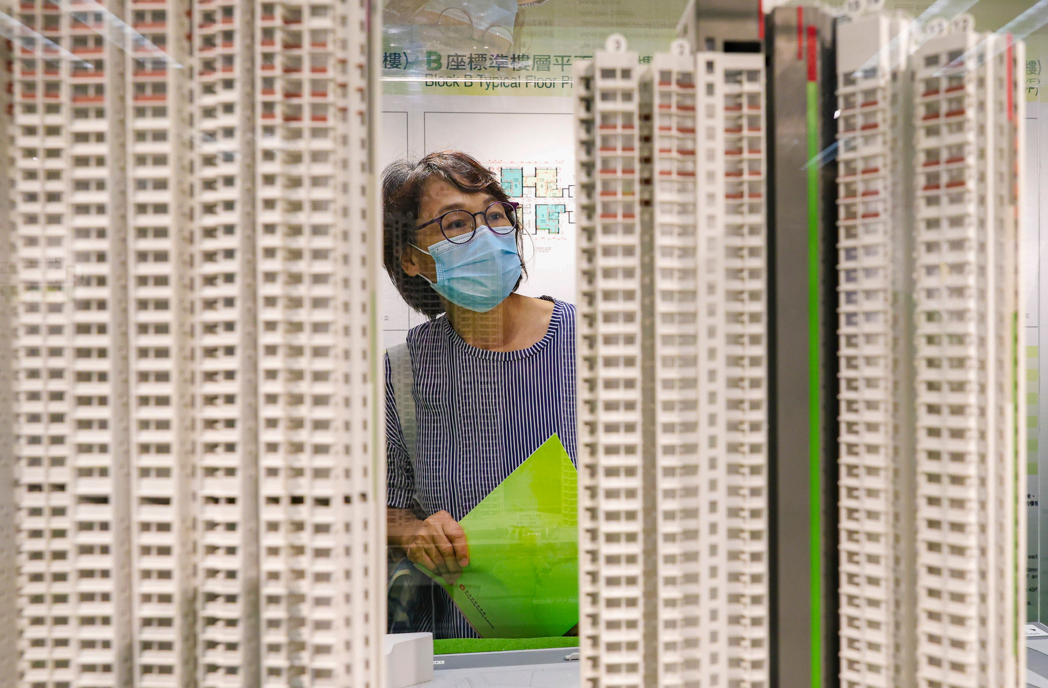 A potential home buyer views scale models of blocks of flats at the Housing Authority’s Home Ownership Scheme sales office in in Kwun Tong. Photo: Yik Yeung-man