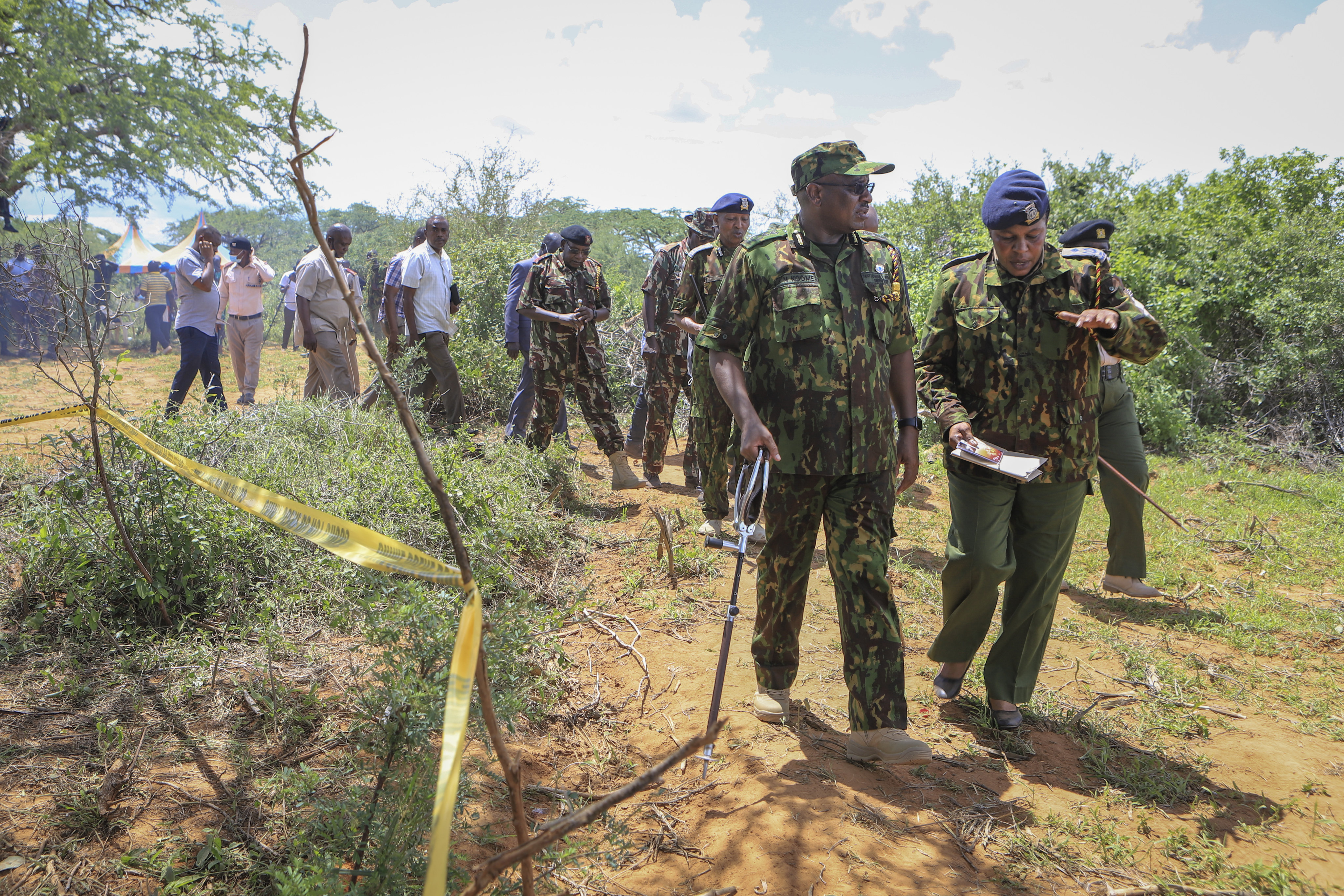 Kenya’s Inspector General of Police, Japhet Koome, second right, tours the scene where dozens of bodies have been found in shallow graves in the village of Shakahola, near the coastal city of Malindi, in southern Kenya. Photo: AP