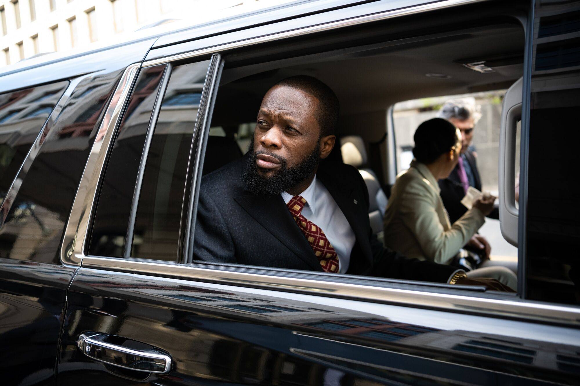 Rapper Pras Michel exits federal court in Washington on April 3. Photo: Bloomberg