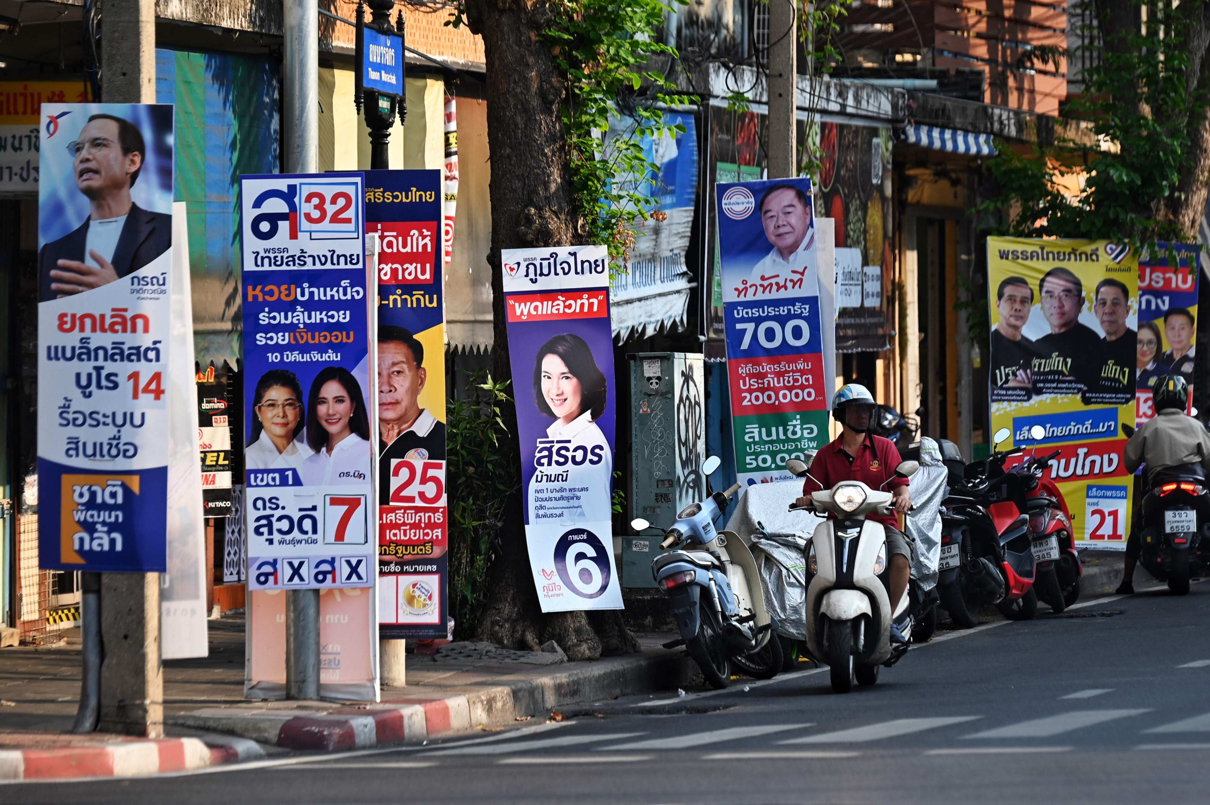 Campaign posters for this year’s general election line a street in Bangkok. Photo: AFP