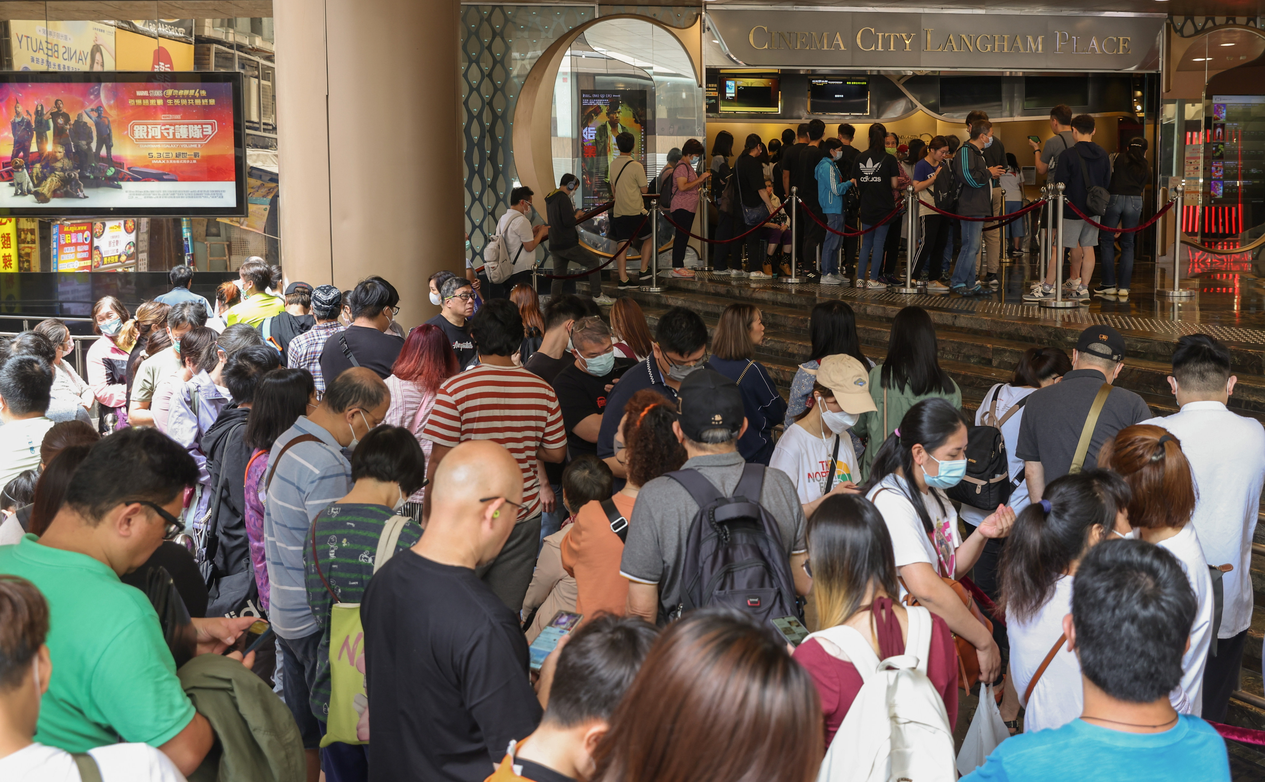 Dozens of people queue to buy movie tickets outside a cinema in Mong Kok on April 27 as online booking services struggled to cope with the high internet traffic driven by the government’s ‘Happy Hong Kong’ campaign. Photo: Yik Yeung-man